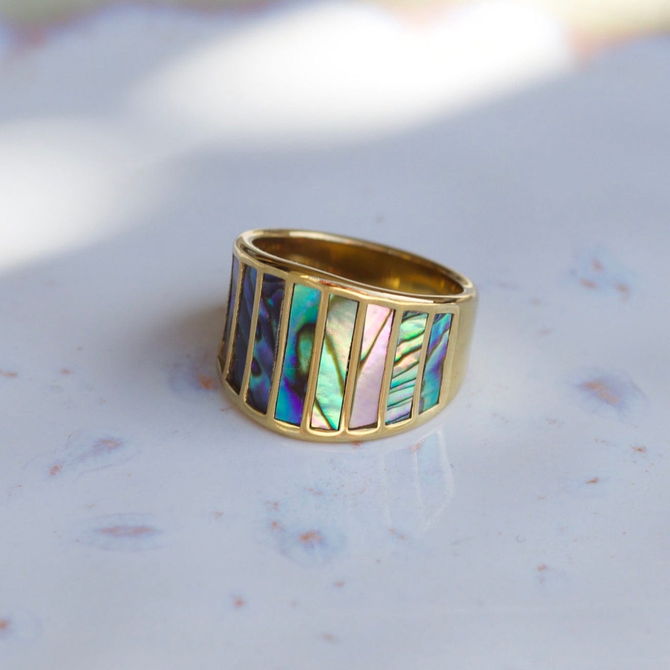 Stella Abalone Shell Statement Ring featuring geometric design and natural abalone shell stones, set in 18K gold plated stainless steel.