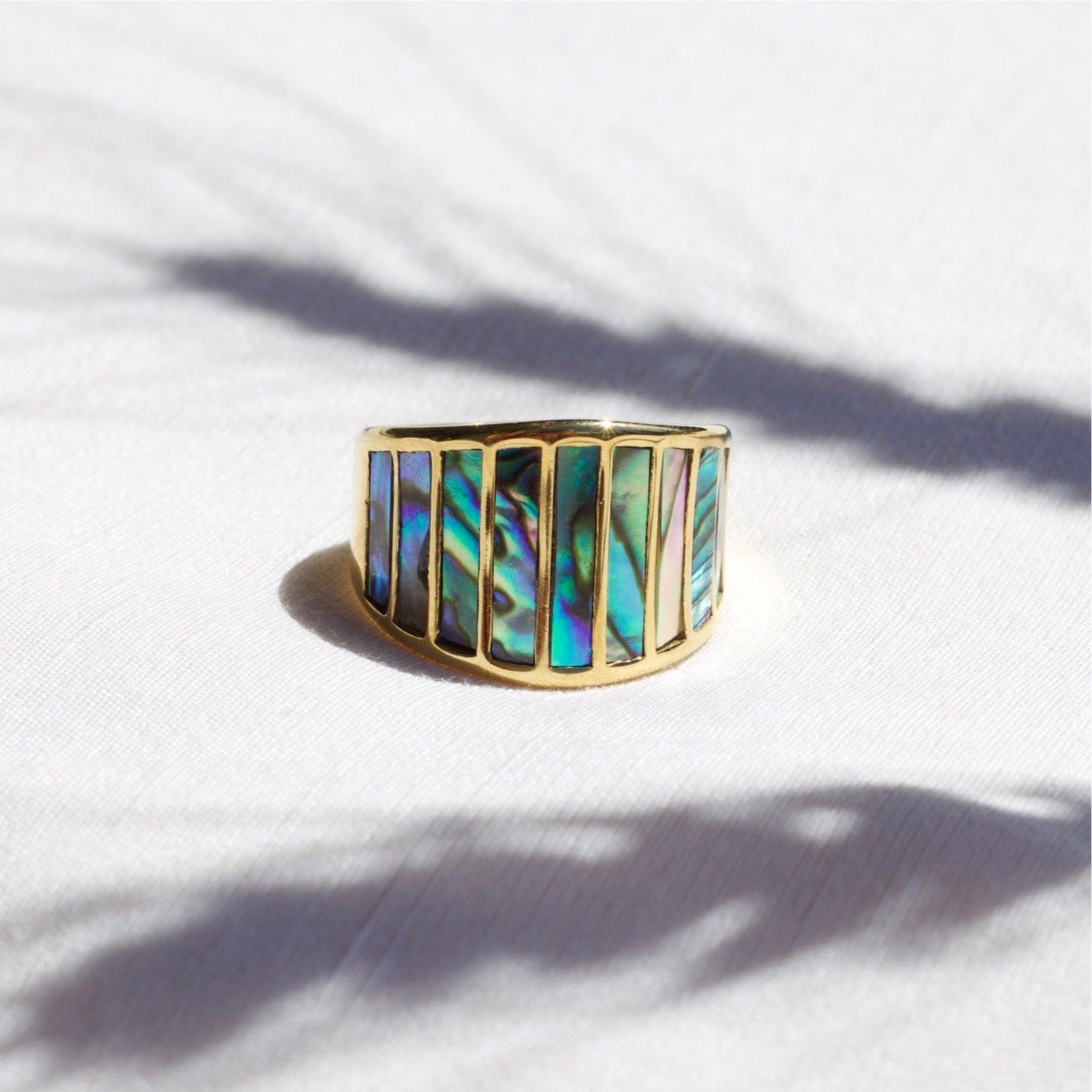 Stella Abalone Shell Statement Ring featuring geometric design and natural abalone shell stones, set in 18K gold plated stainless steel.