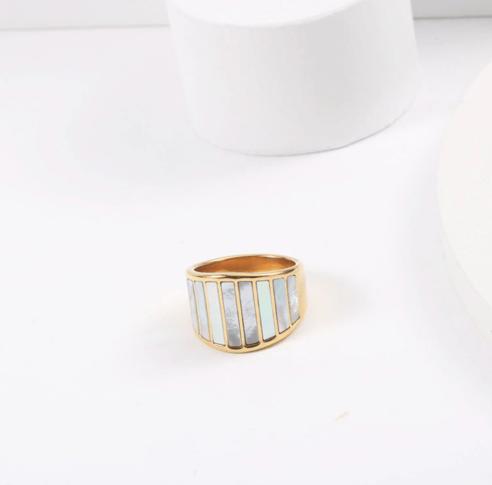 Stella Mother of Pearl Statement Ring featuring a bold geometric design with natural white shell stones and 18K gold plating.