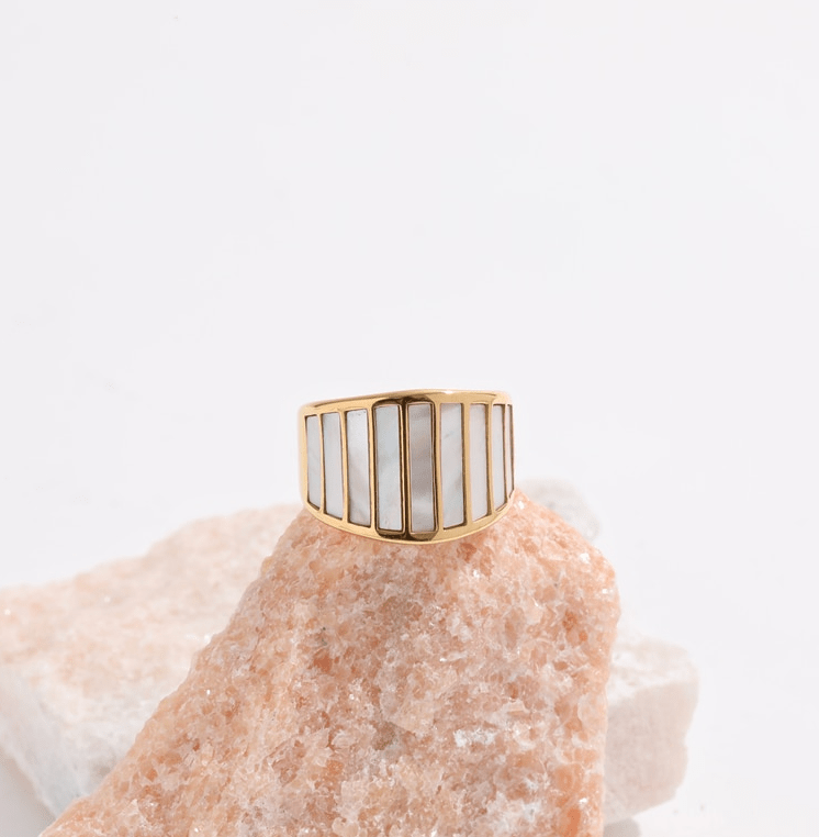 Stella Mother of Pearl Statement Ring featuring a bold geometric design with natural white shell stones and 18K gold plating.