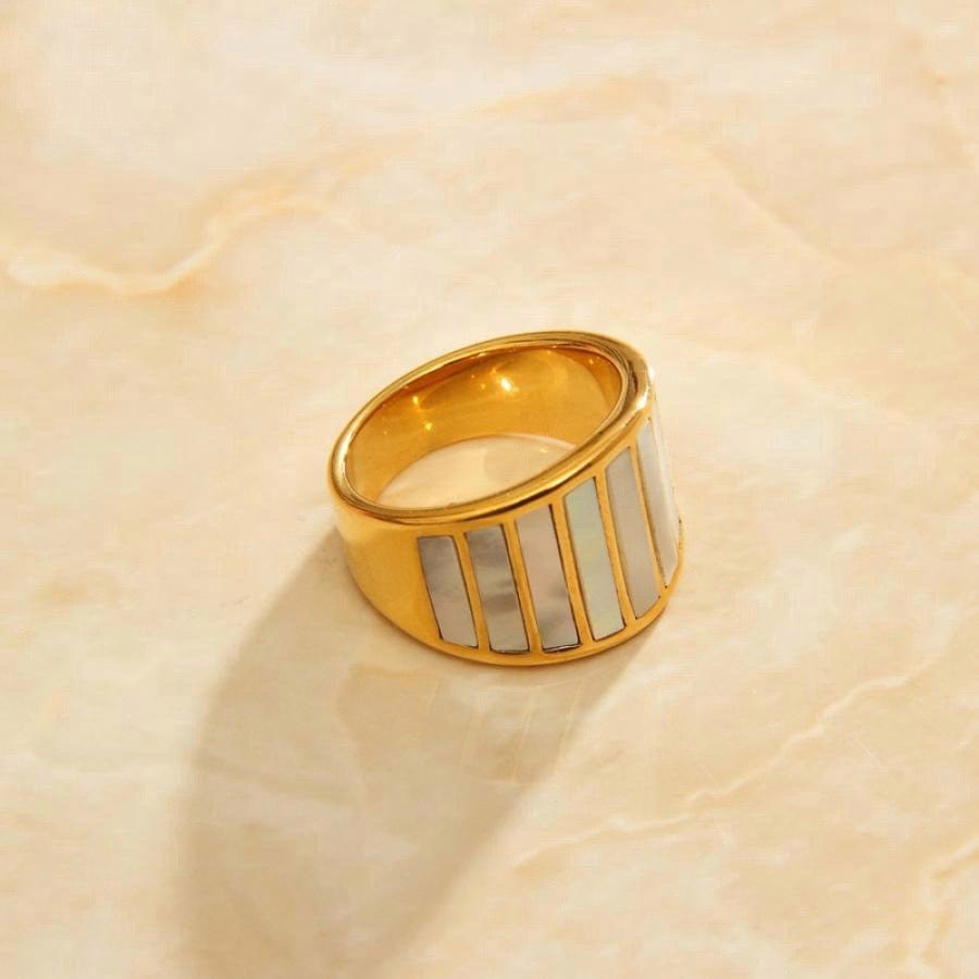 Stella Mother of Pearl Statement Ring featuring a bold geometric design with natural white shell stones and 18K gold plating.