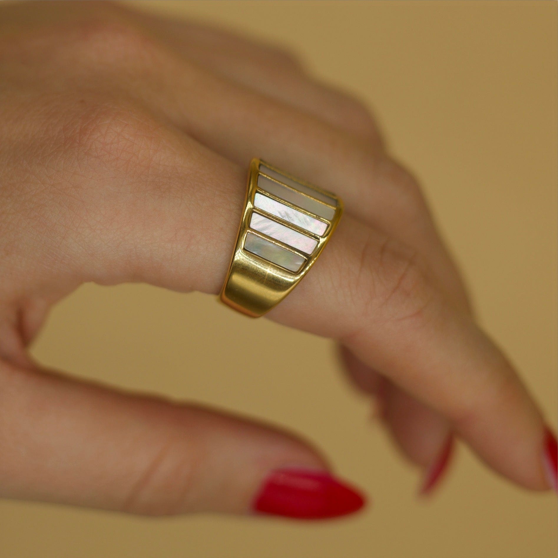 Stella Mother of Pearl Statement Ring featuring a bold geometric design with natural white shell stones and 18K gold plating.