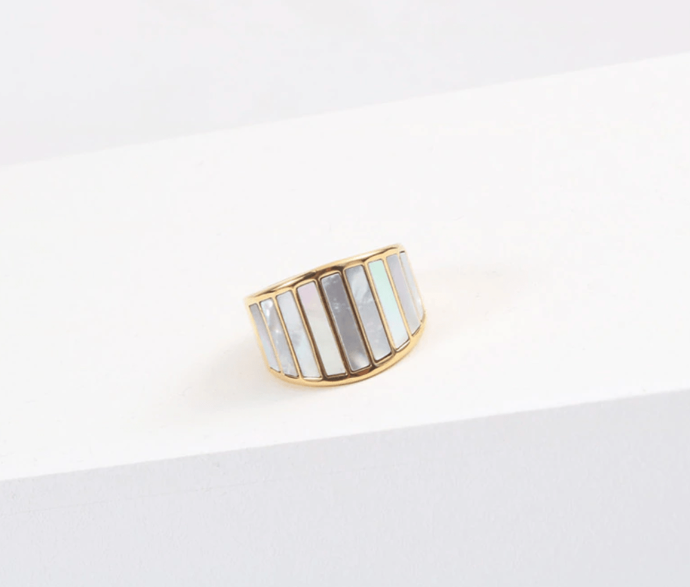 Stella Mother of Pearl Statement Ring featuring a bold geometric design with natural white shell stones and 18K gold plating.