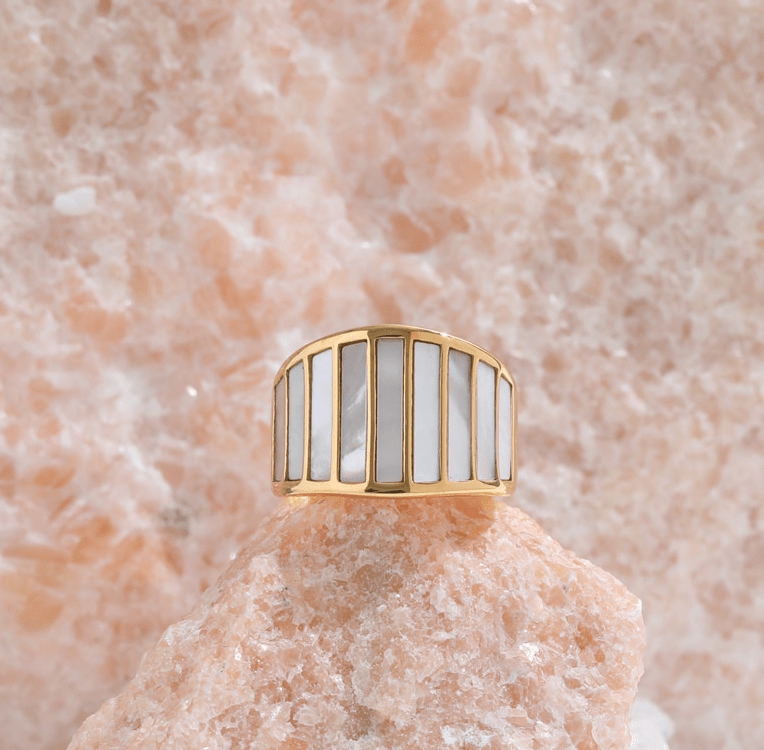 Stella Mother of Pearl Statement Ring featuring a bold geometric design with natural white shell stones and 18K gold plating.