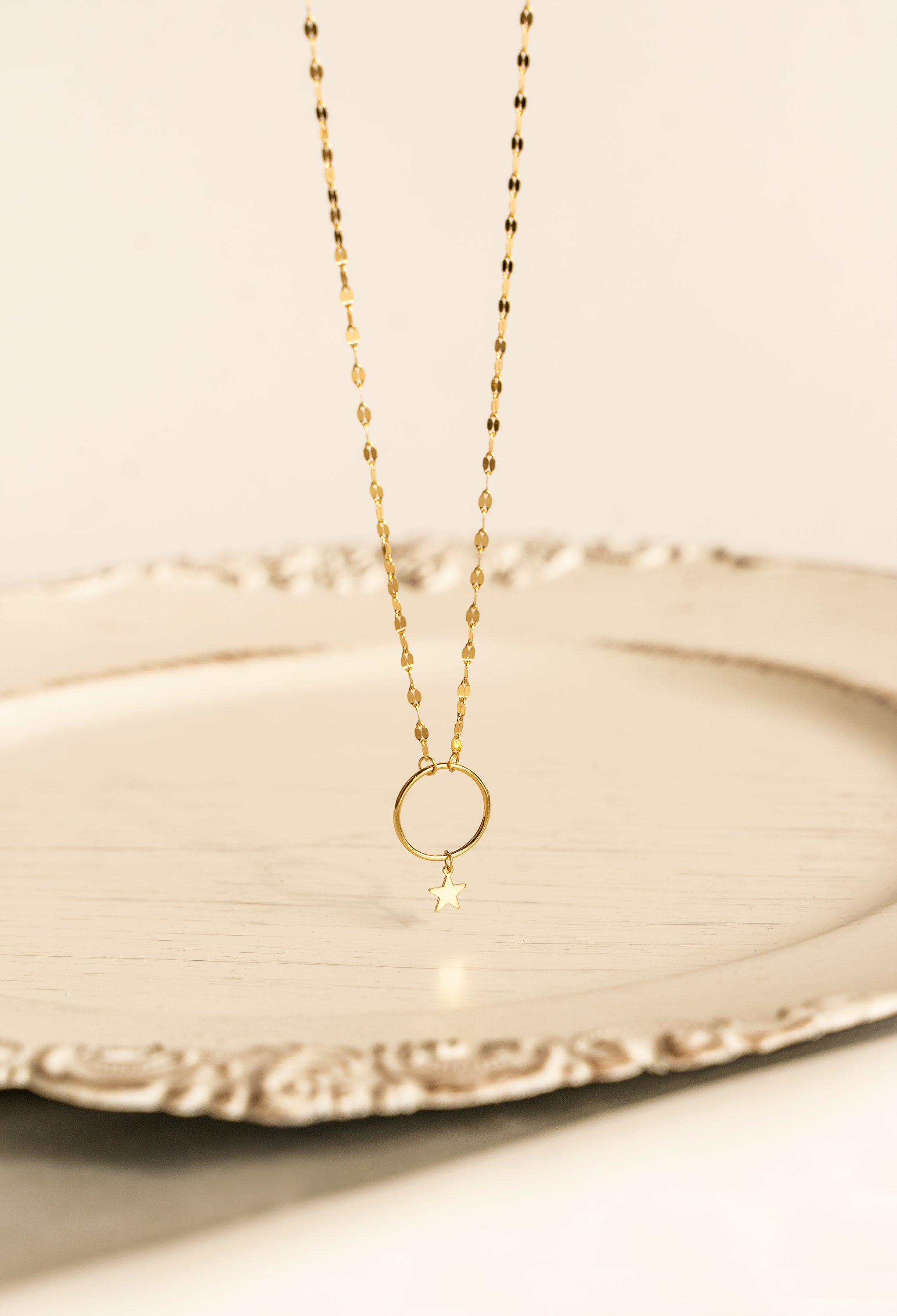 STELLA Star Choker featuring a tiny star and hoop pendant on a double row mirror link chain, elegantly crafted in 18k gold plating.