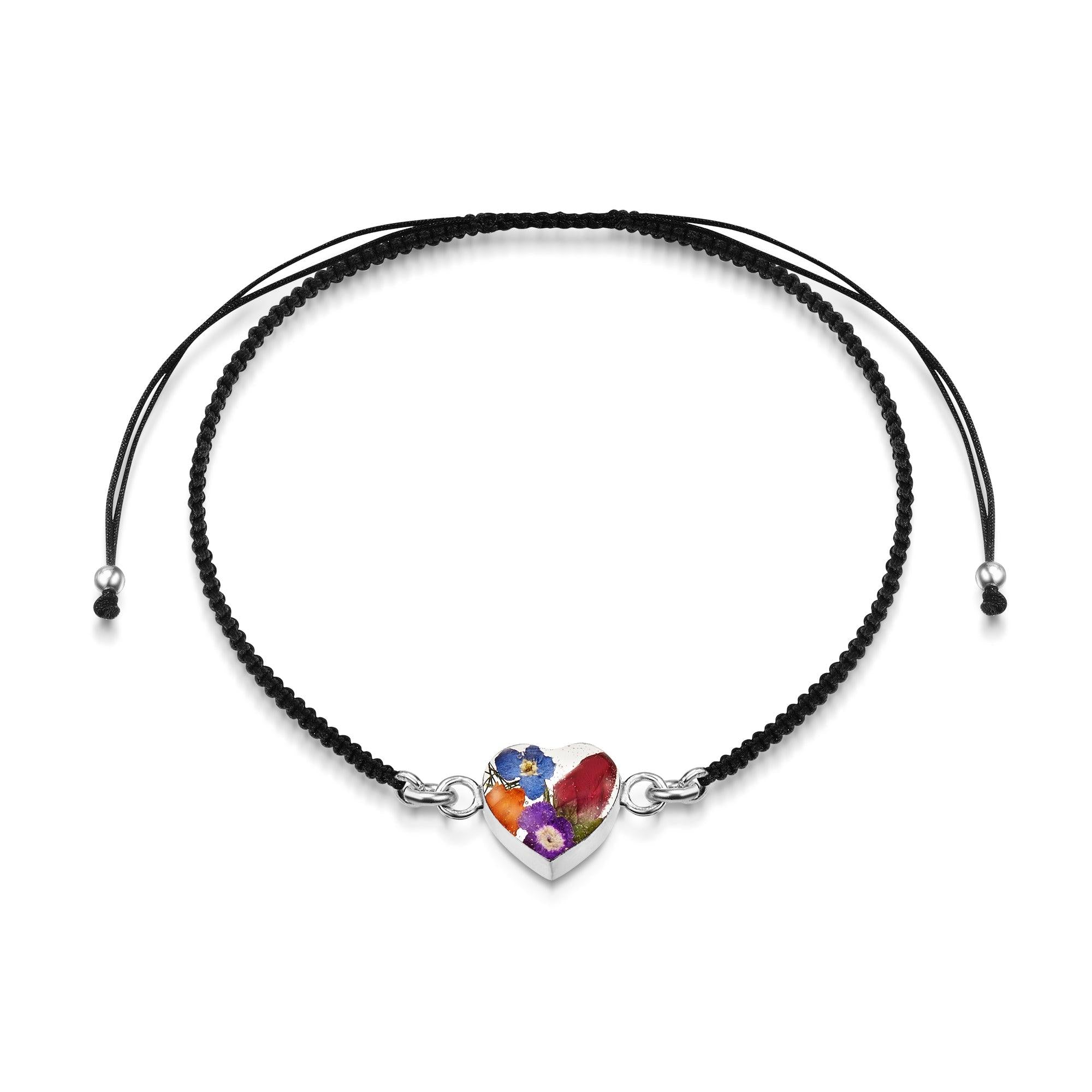 Sterling Silver black woven bracelet featuring a mixed flower charm, showcasing intricate details and elegant design.