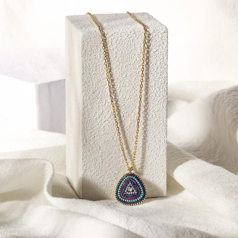 A beautiful sterling silver evil eye necklace featuring a turquoise charm and embedded zircon stones, elegantly displayed in a gift box.