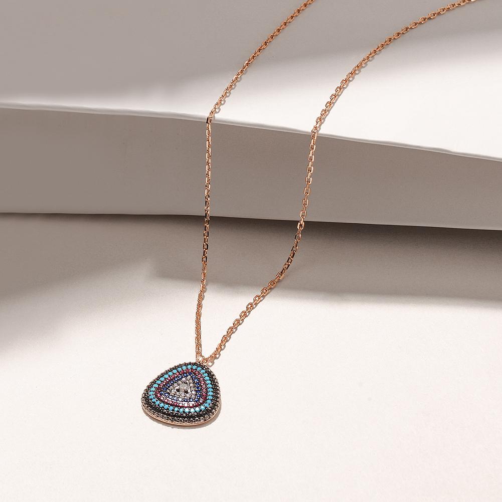 A beautiful sterling silver evil eye necklace featuring a turquoise charm and embedded zircon stones, elegantly displayed in a gift box.