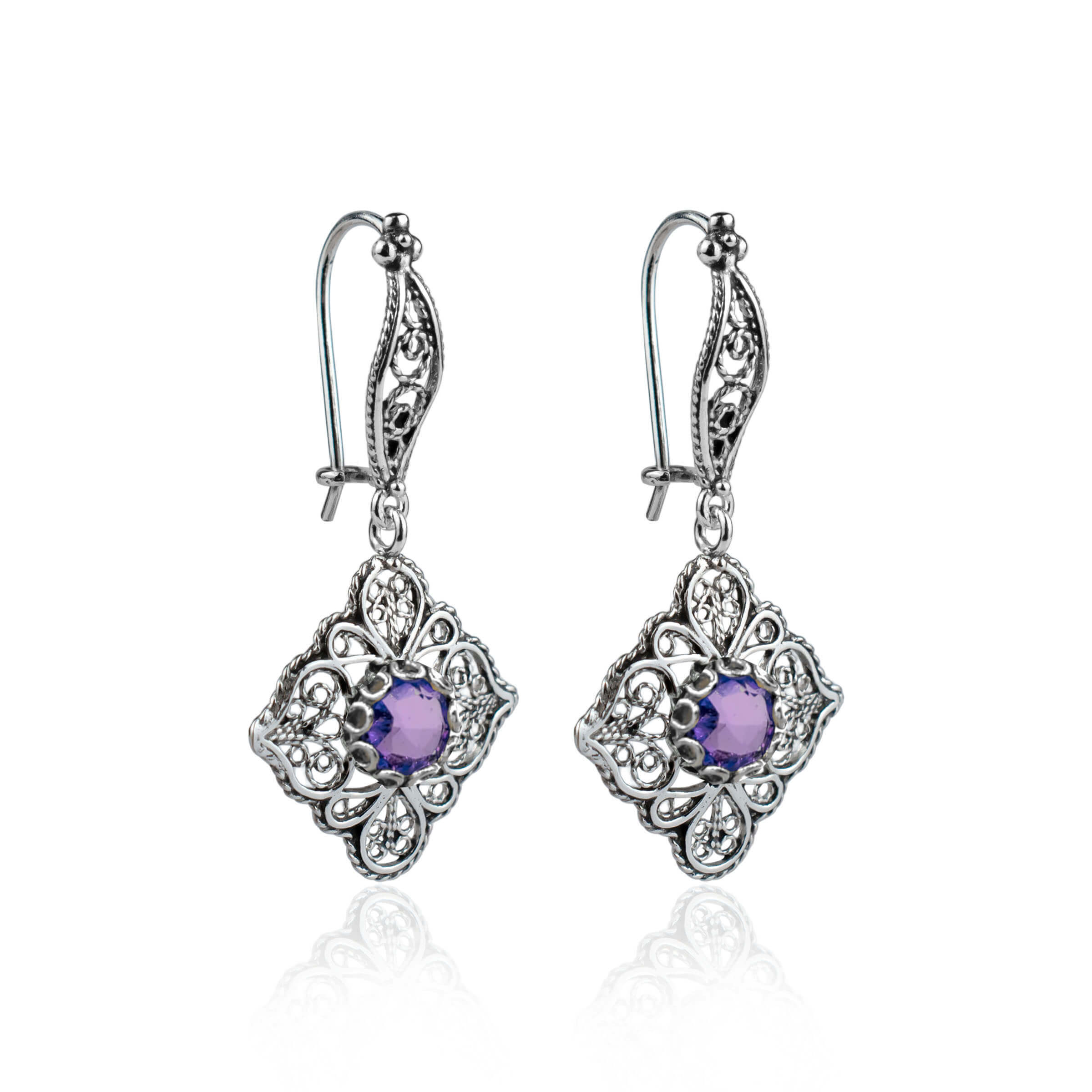 Sterling silver dangle drop earrings featuring intricate filigree art and purple Amethyst gemstones.