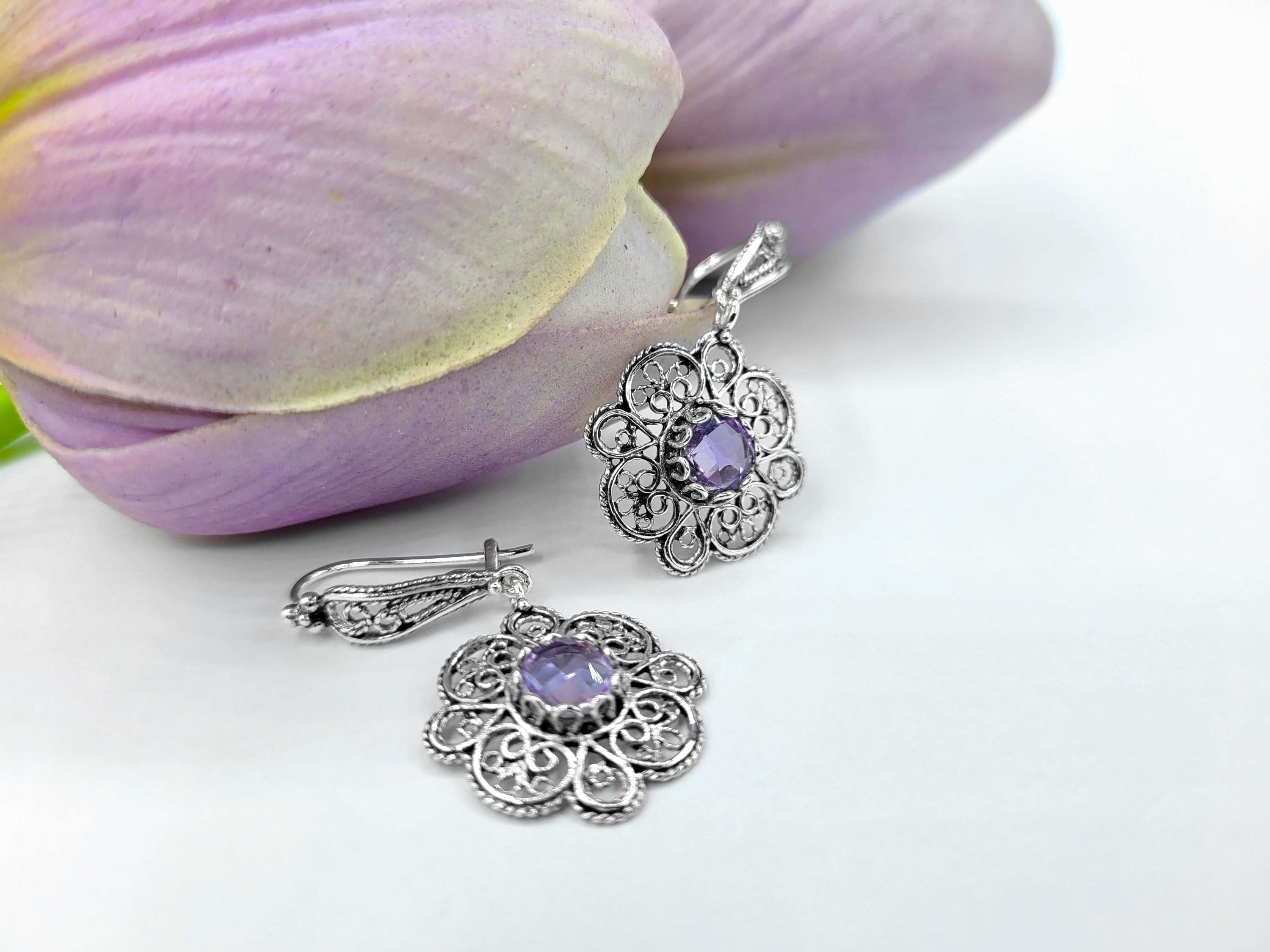 Handmade 925 sterling silver dangle drop earrings featuring intricate filigree art and a stunning Amethyst gemstone in a sun figure design.