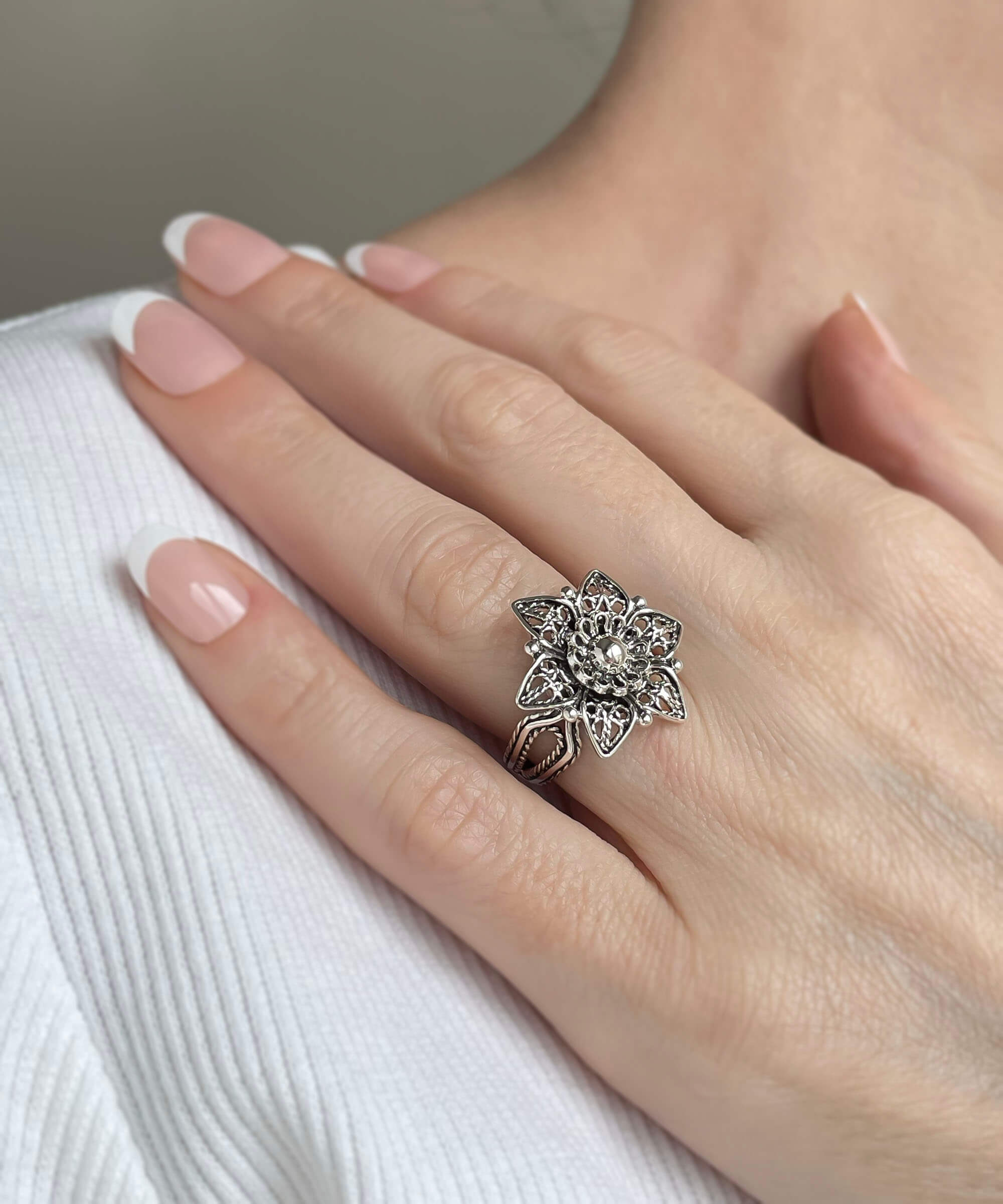 Sterling Silver Filigree Art Lotus Flower Cocktail Ring with intricate design and polished finish, displayed elegantly.