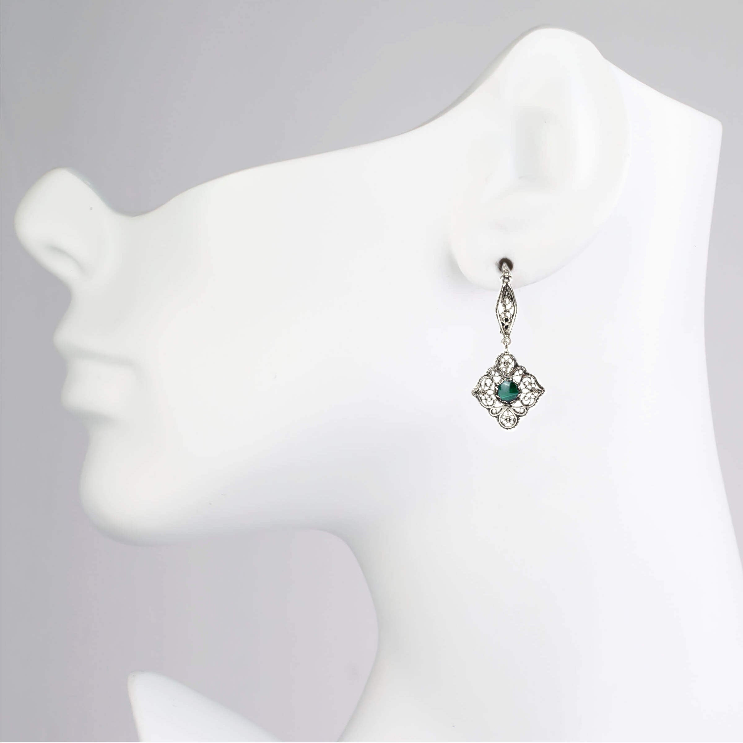 Elegant sterling silver dangle drop earrings featuring intricate filigree art and round cut Malachite gemstones, perfect for women.