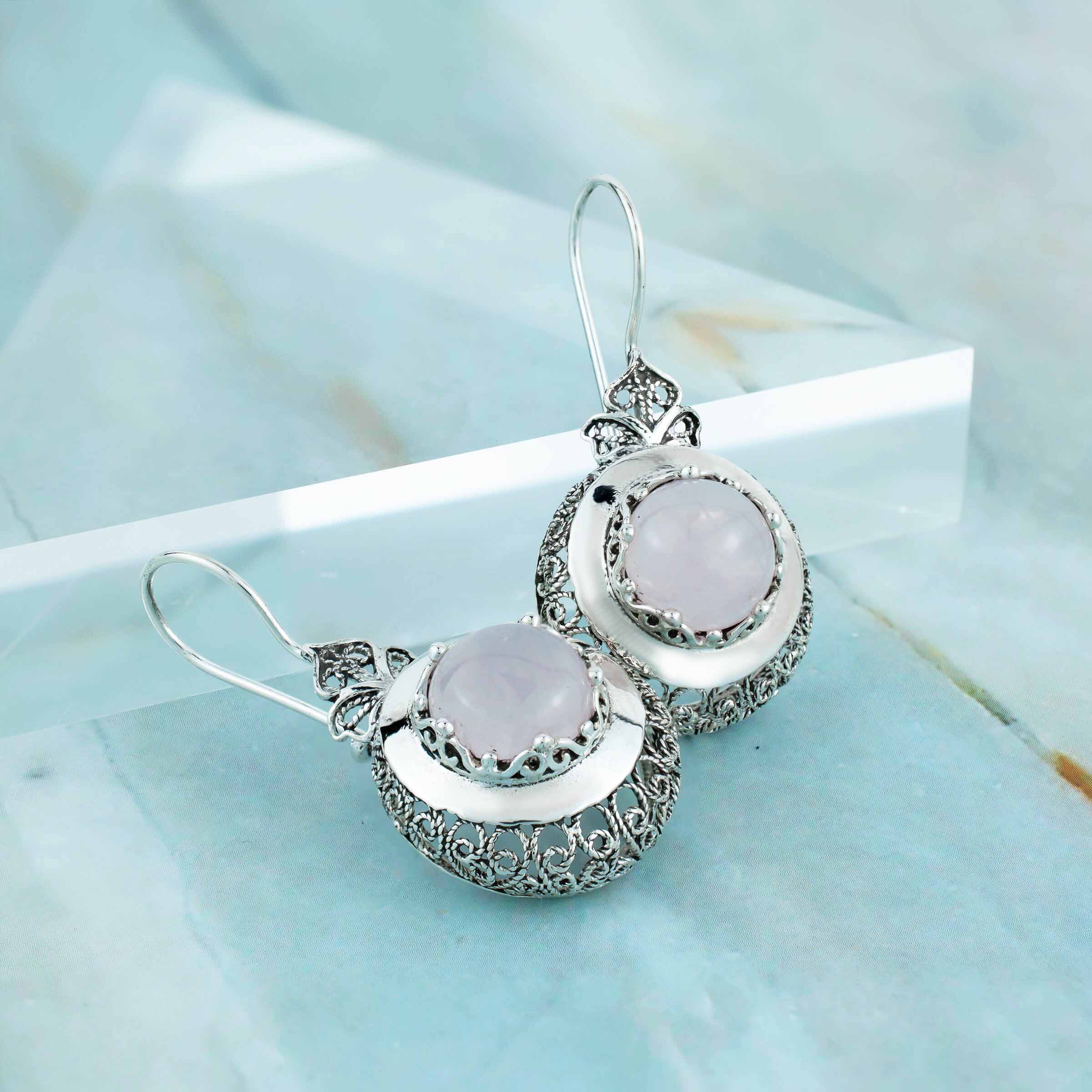 Sterling Silver Filigree Art Drop Earrings featuring a round-cut rose quartz gemstone, showcasing intricate metalwork and elegant design.