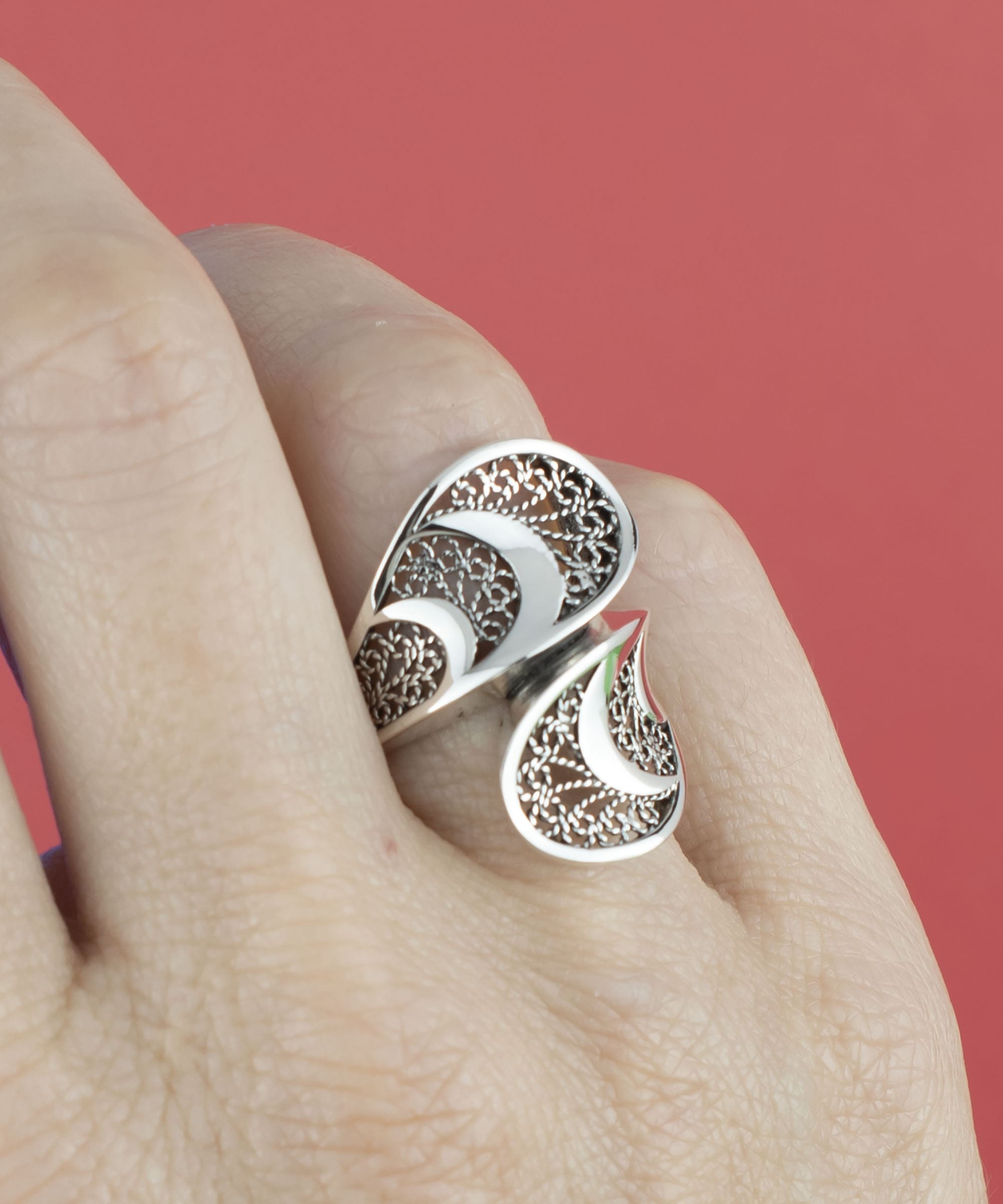 Sterling Silver Filigree Art Twisted Bypass Cocktail Ring showcasing intricate filigree design and elegant twisted shape.