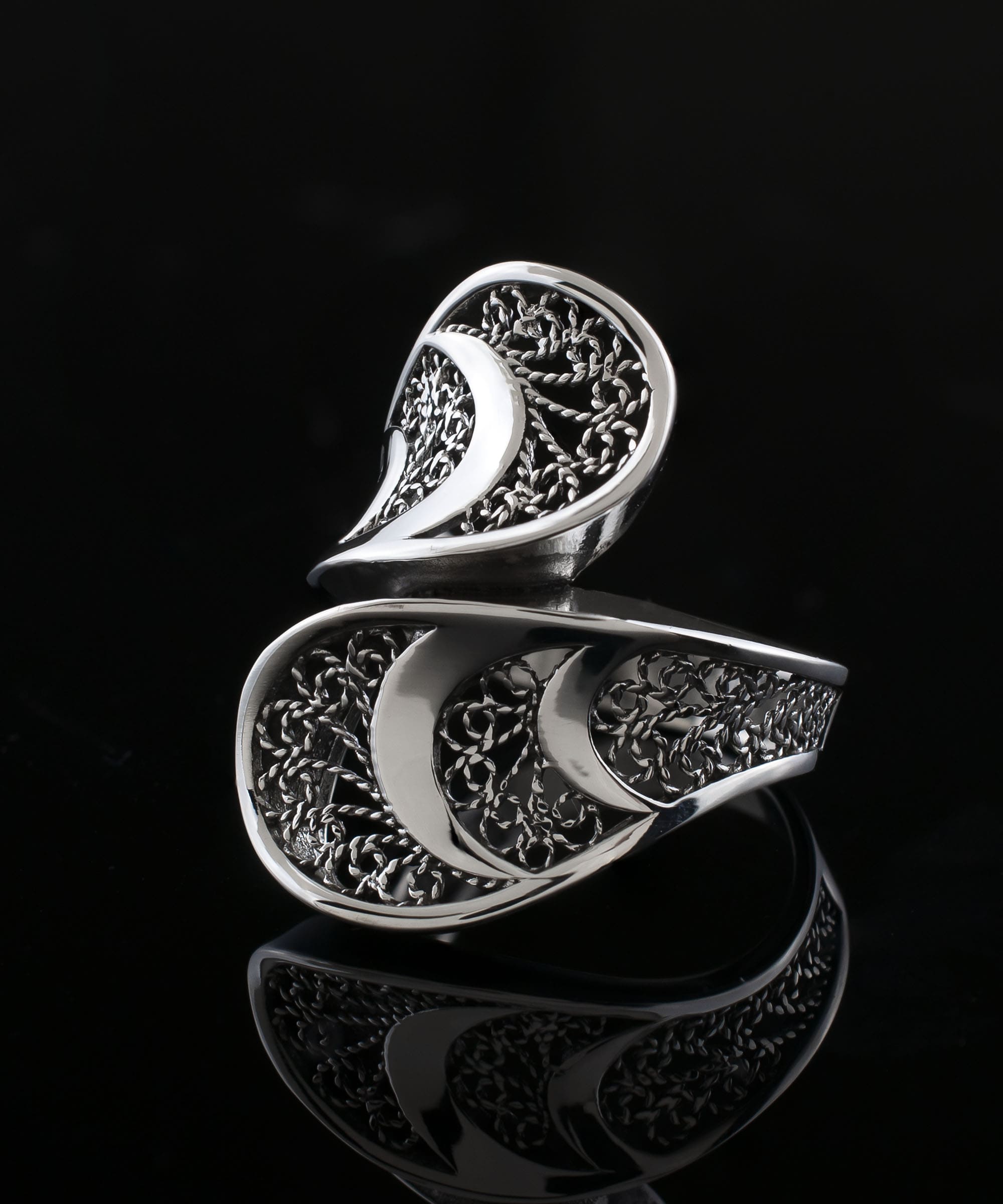 Sterling Silver Filigree Art Twisted Bypass Cocktail Ring showcasing intricate filigree design and elegant twisted shape.