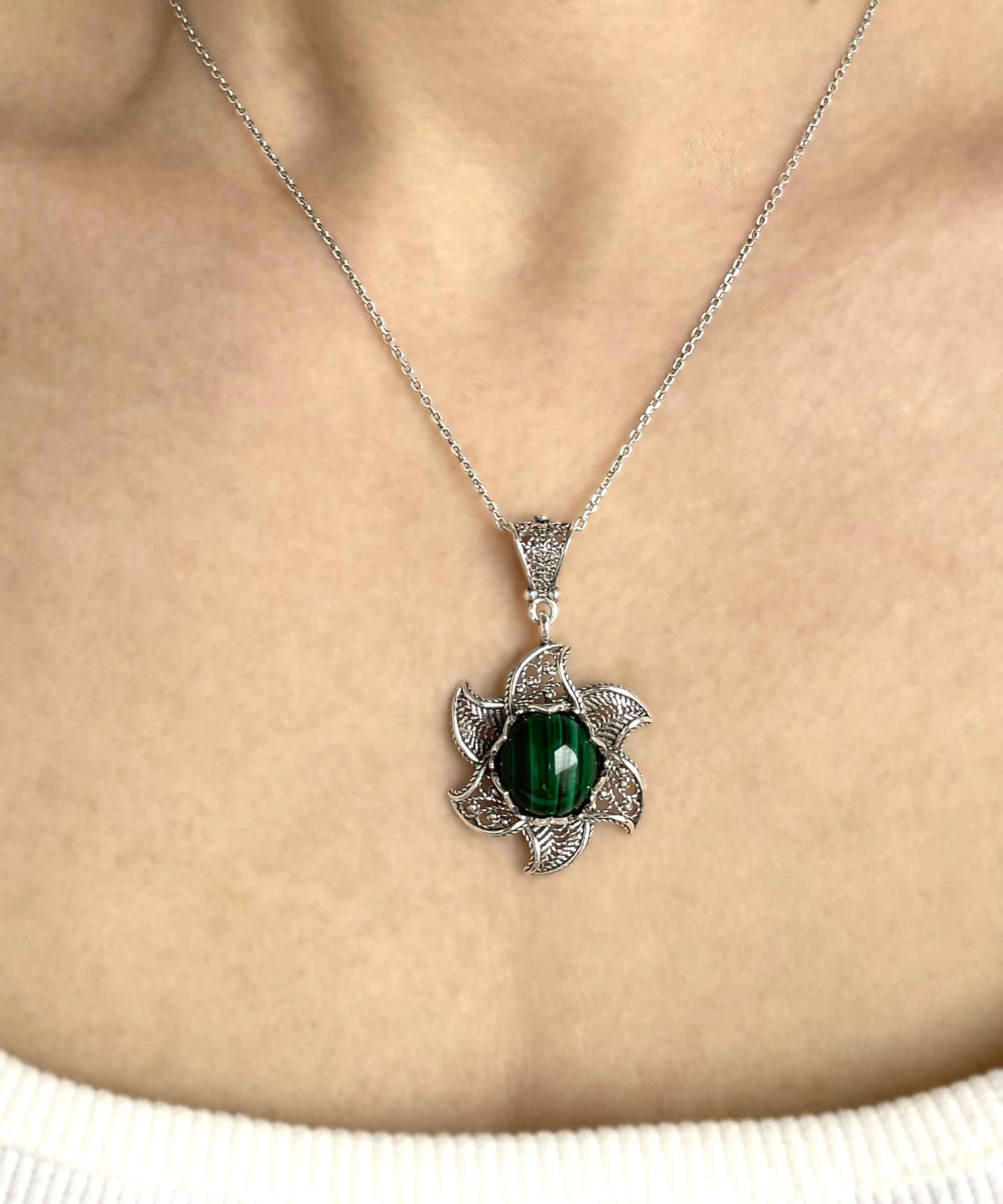 Sterling Silver Filigree Malachite Gemstone Blossoming Lotus Flower pendant on a delicate silver chain, showcasing intricate design and vibrant gemstone.