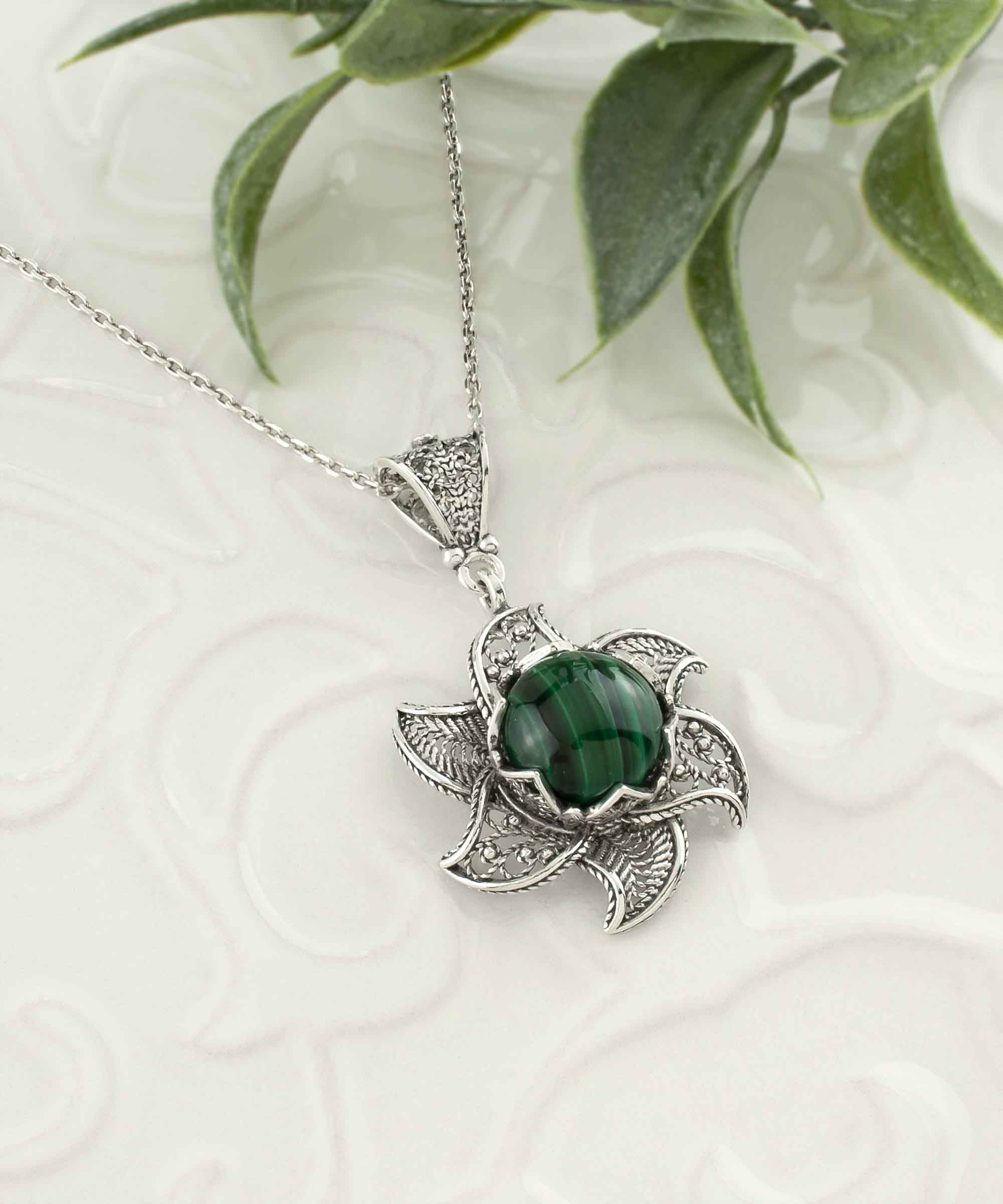 Sterling Silver Filigree Malachite Gemstone Blossoming Lotus Flower pendant on a delicate silver chain, showcasing intricate design and vibrant gemstone.