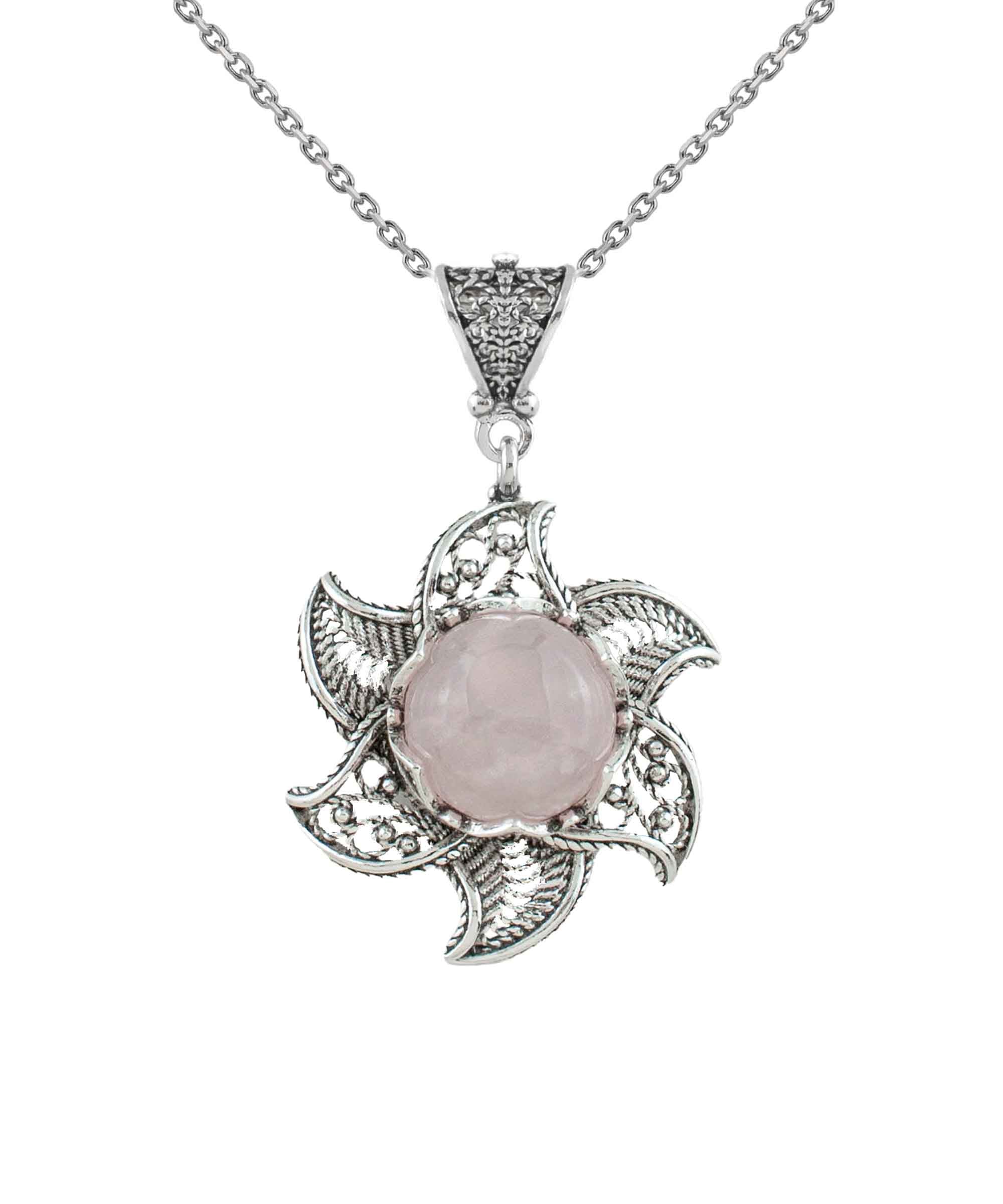 Sterling silver filigree lotus flower pendant with rose quartz gemstone, elegantly designed and polished.