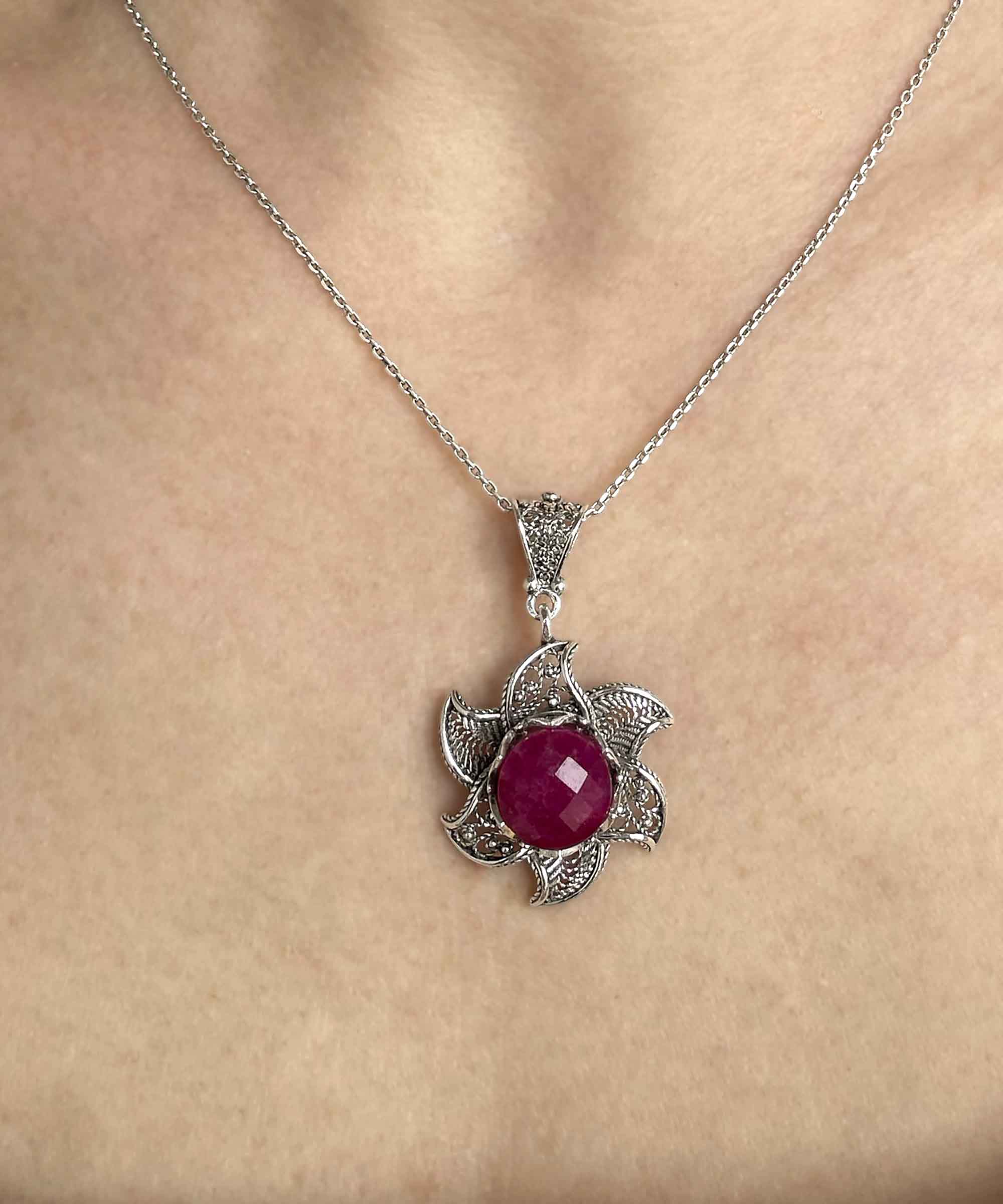 Sterling Silver Filigree Ruby Corundum Gemstone Blossoming Lotus necklace featuring a 3D lotus flower pendant with a vibrant ruby gemstone.