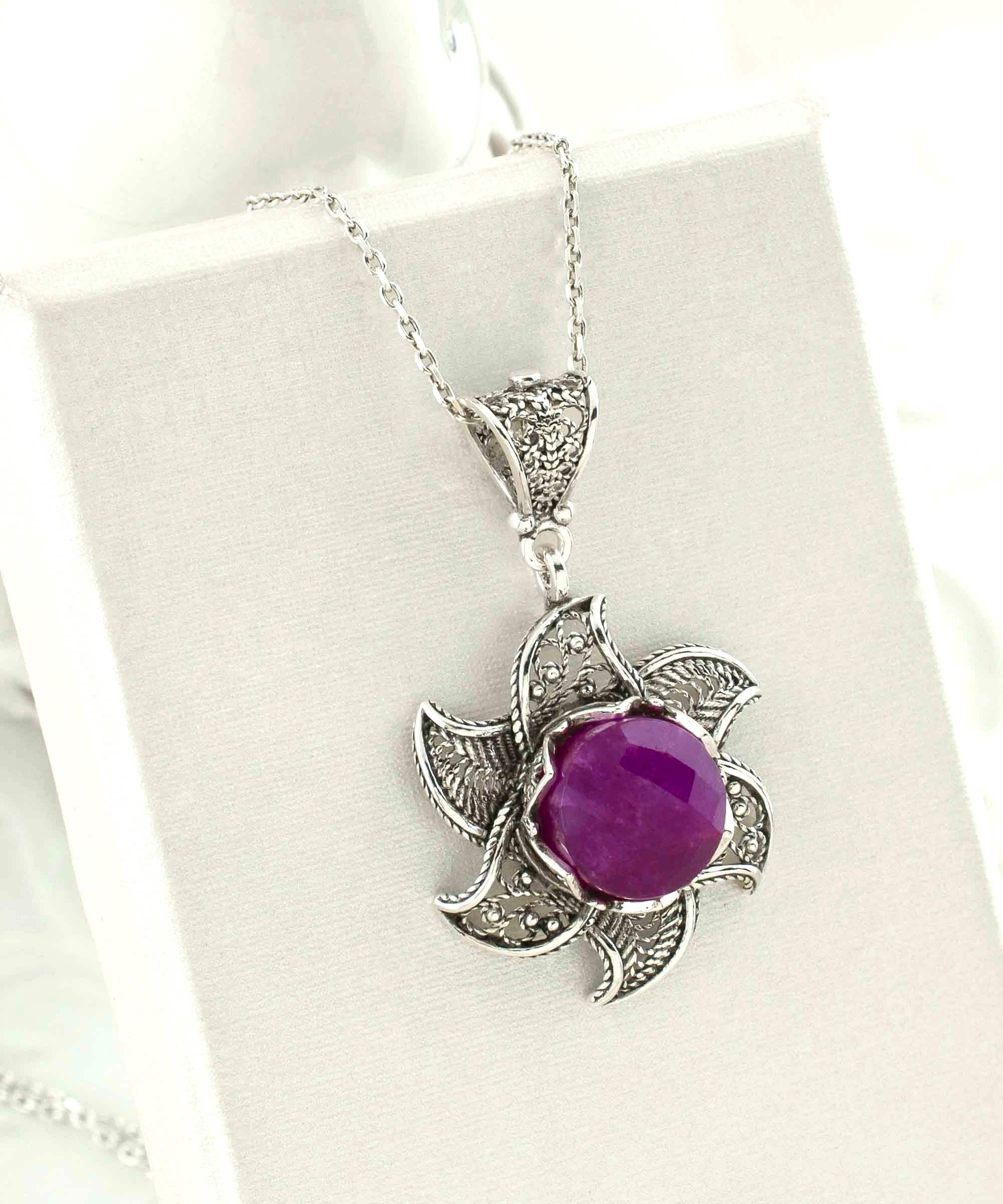 Sterling Silver Filigree Ruby Corundum Gemstone Blossoming Lotus necklace featuring a 3D lotus flower pendant with a vibrant ruby gemstone.