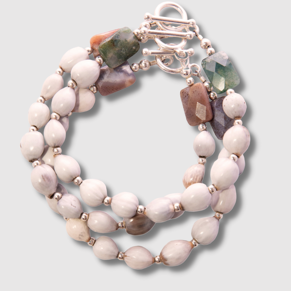 Sterling Silver Majok Stackable Bracelet featuring cream and grey-toned Haitian majok seeds, sterling silver beads, and jasper gemstones.