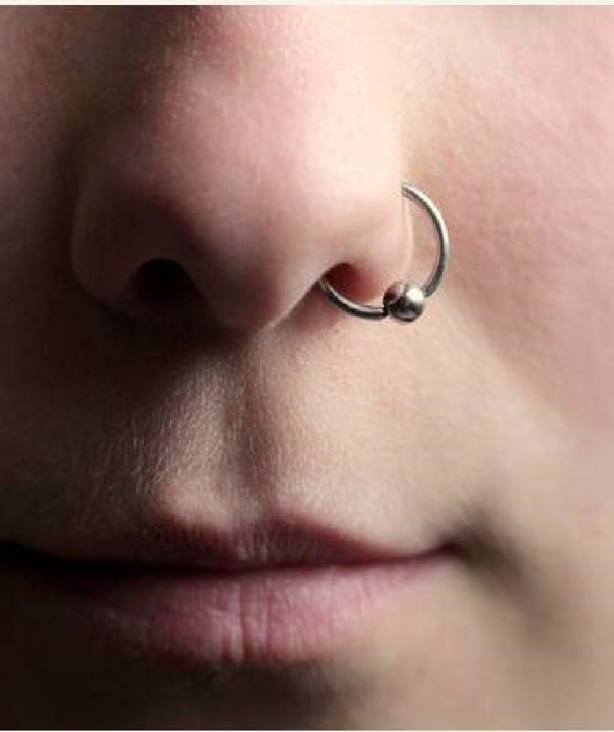 Elegant sterling silver nose ring with a secure ball closure, suitable for various piercings.