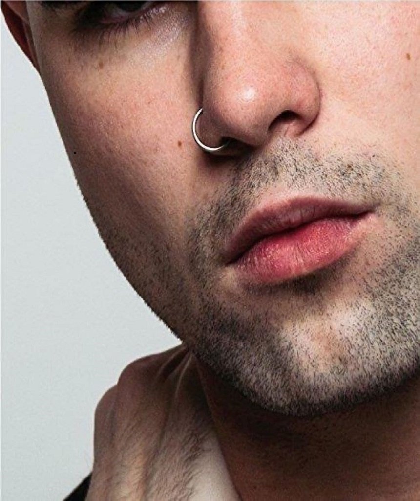 Elegant sterling silver nose ring with a secure ball closure, suitable for various piercings.