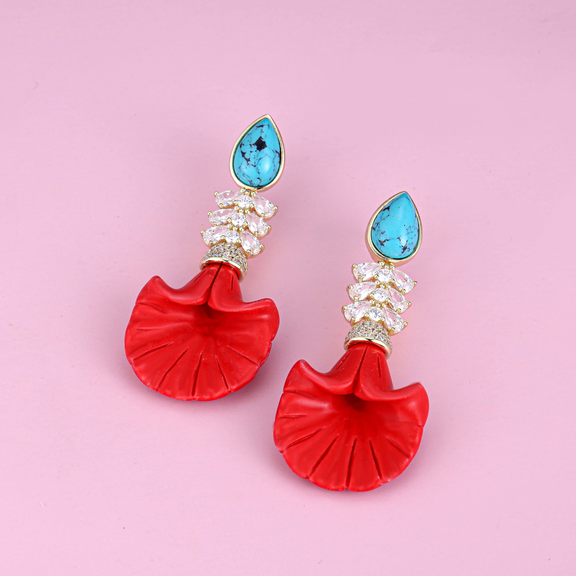 A pair of sterling silver earrings featuring turquoise drops, elegantly designed for a stylish look.