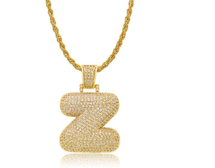 STILTR Steel Bubble Initial Necklace featuring a rhinestone-studded initial pendant on a 24-inch solid rope chain.