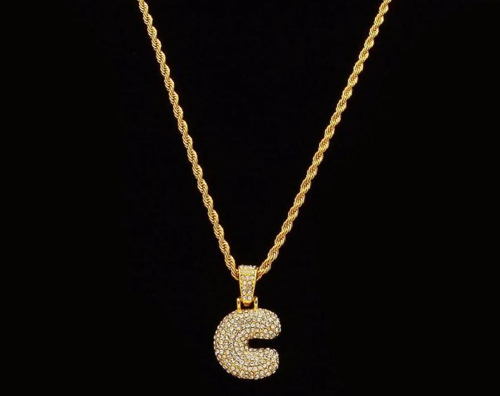 STILTR Steel Bubble Initial Necklace featuring a rhinestone-studded initial pendant on a 24-inch solid rope chain.