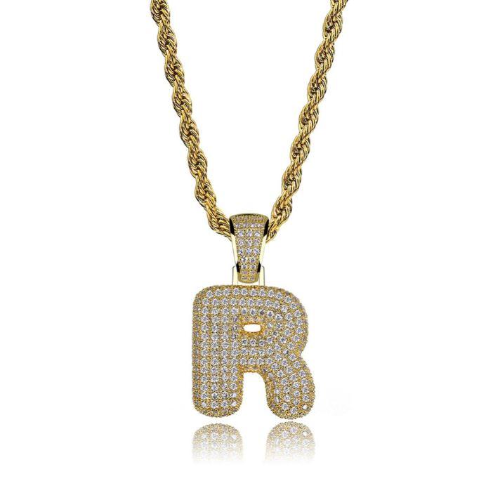 STILTR Steel Bubble Initial Necklace featuring a rhinestone-studded initial pendant on a 24-inch solid rope chain.