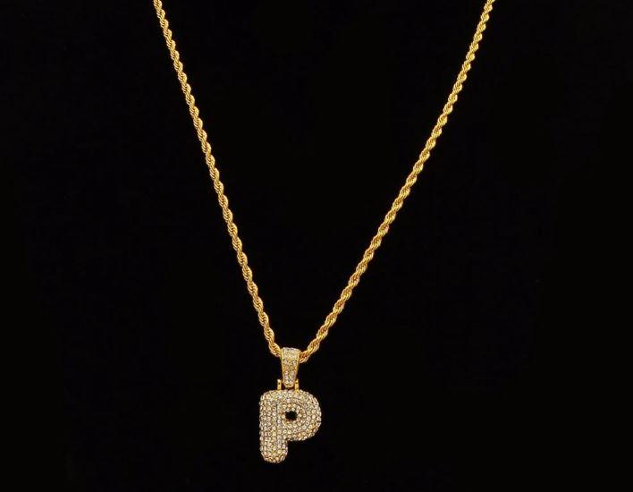 STILTR Steel Bubble Initial Necklace featuring a rhinestone-studded initial pendant on a 24-inch solid rope chain.