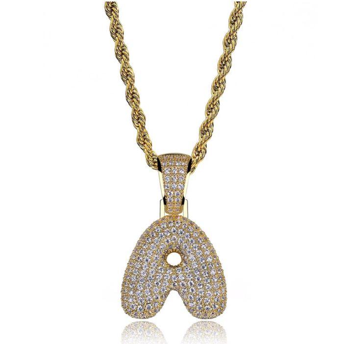 STILTR Steel Bubble Initial Necklace featuring a rhinestone-studded initial pendant on a 24-inch solid rope chain.