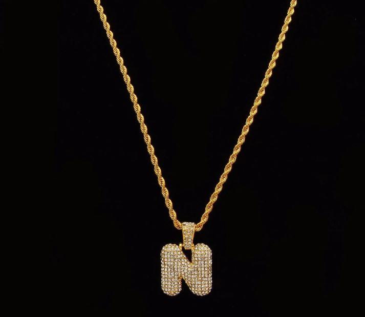 STILTR Steel Bubble Initial Necklace featuring a rhinestone-studded initial pendant on a 24-inch solid rope chain.