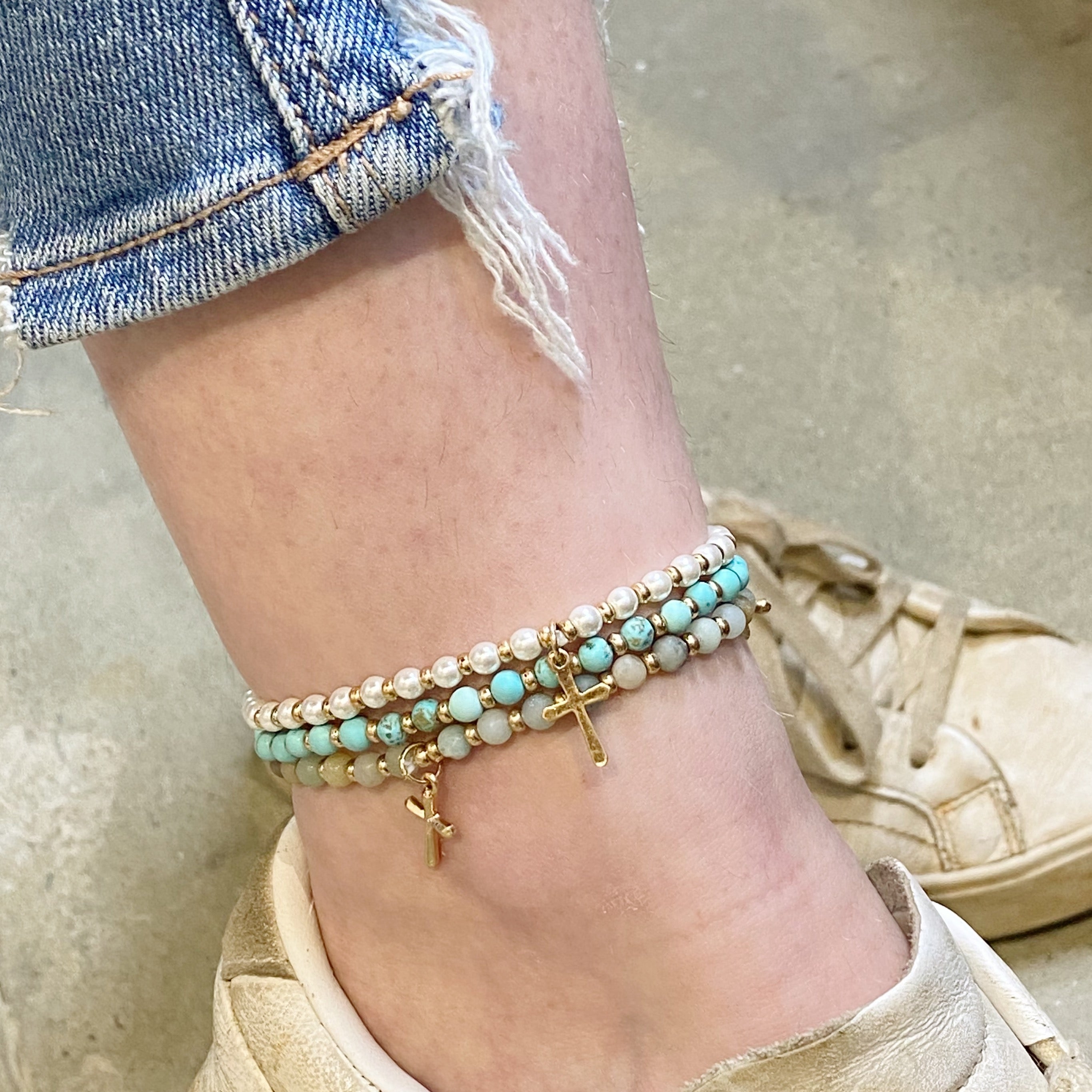 Stone Bead Cross Anklet featuring semi-precious stones and a gold-plated cross charm, elegantly displayed on a soft background.