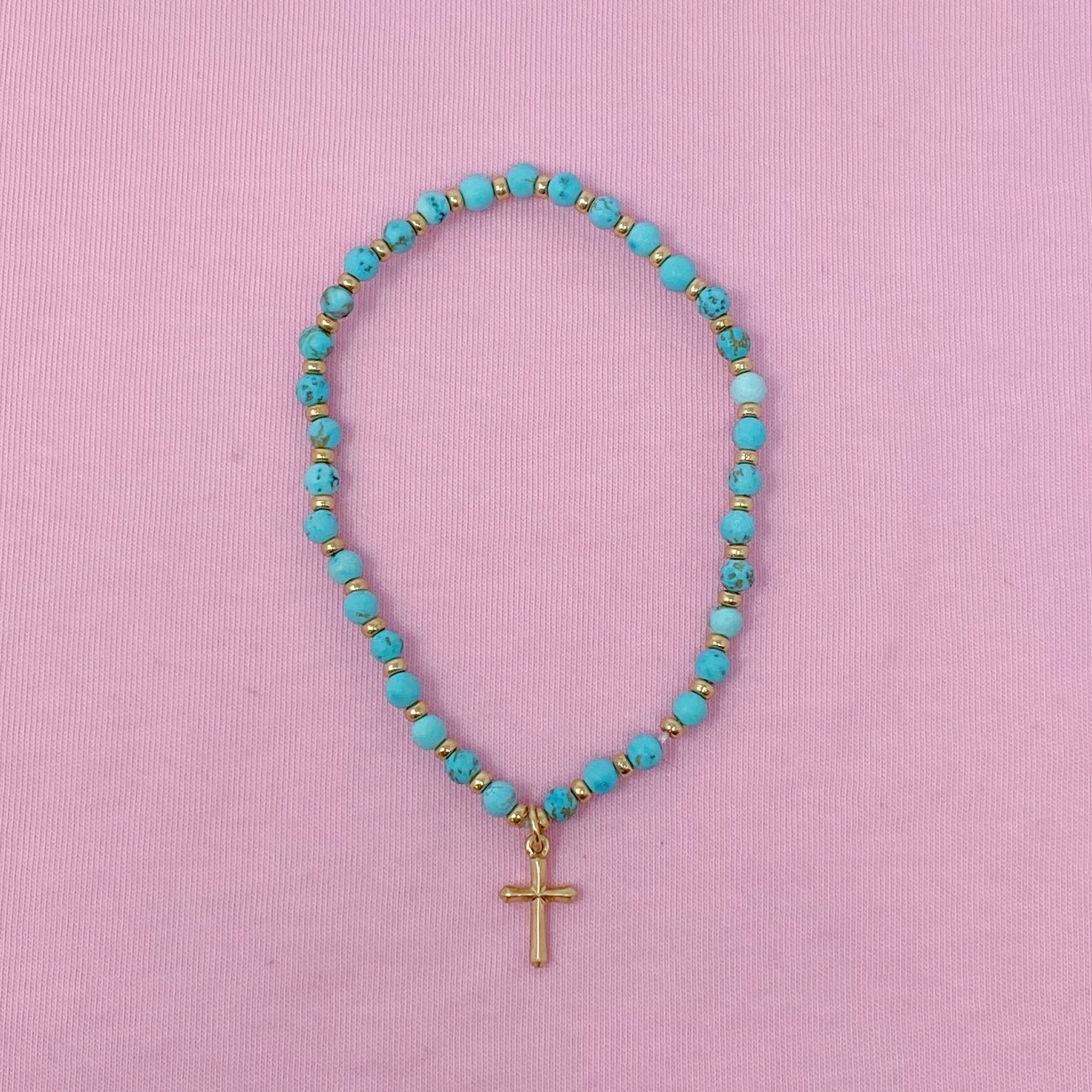 Stone Bead Cross Anklet featuring semi-precious stones and a gold-plated cross charm, elegantly displayed on a soft background.