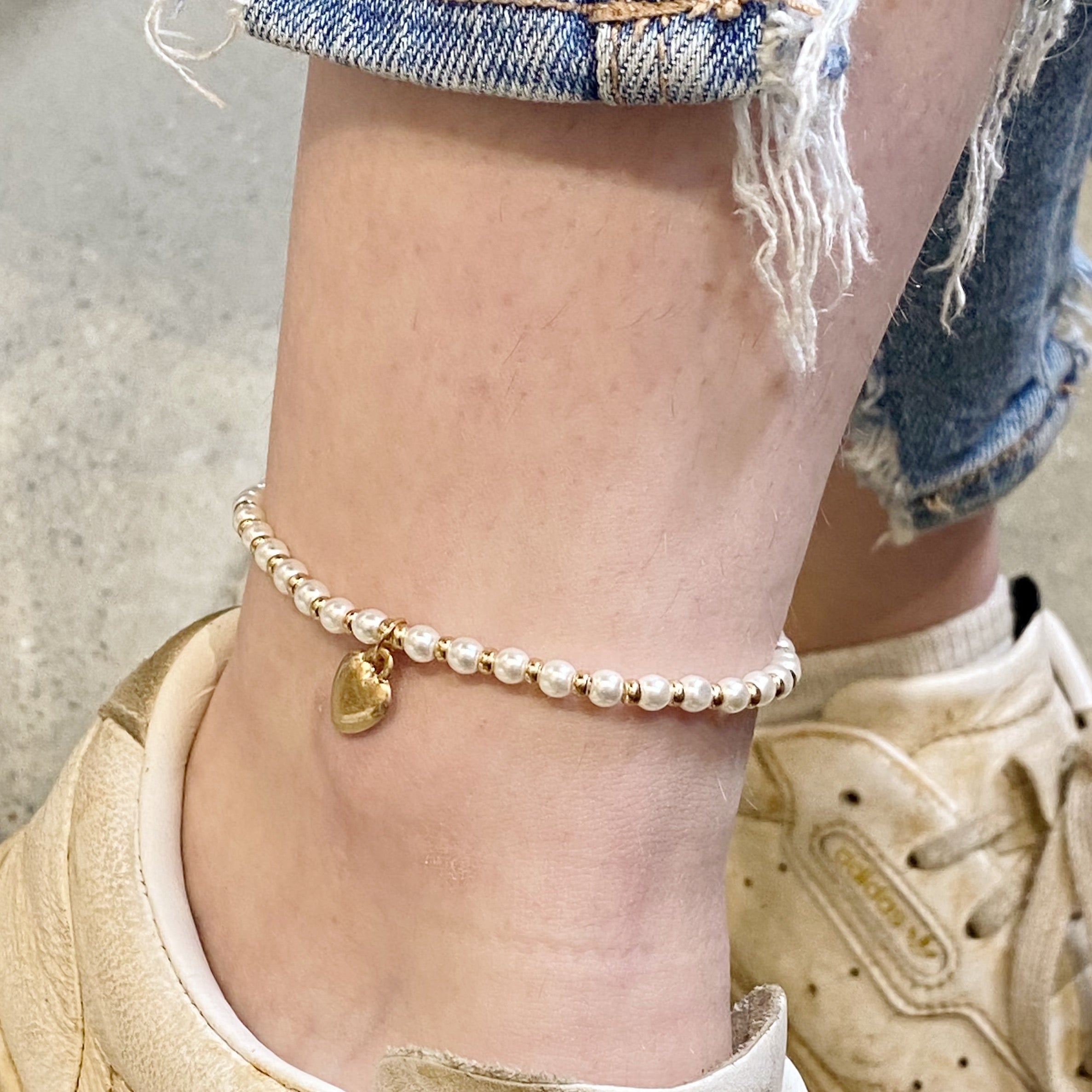 A beautiful stone bead heart anklet featuring semi-precious beads and a charming heart dangle charm, perfect for stacking.