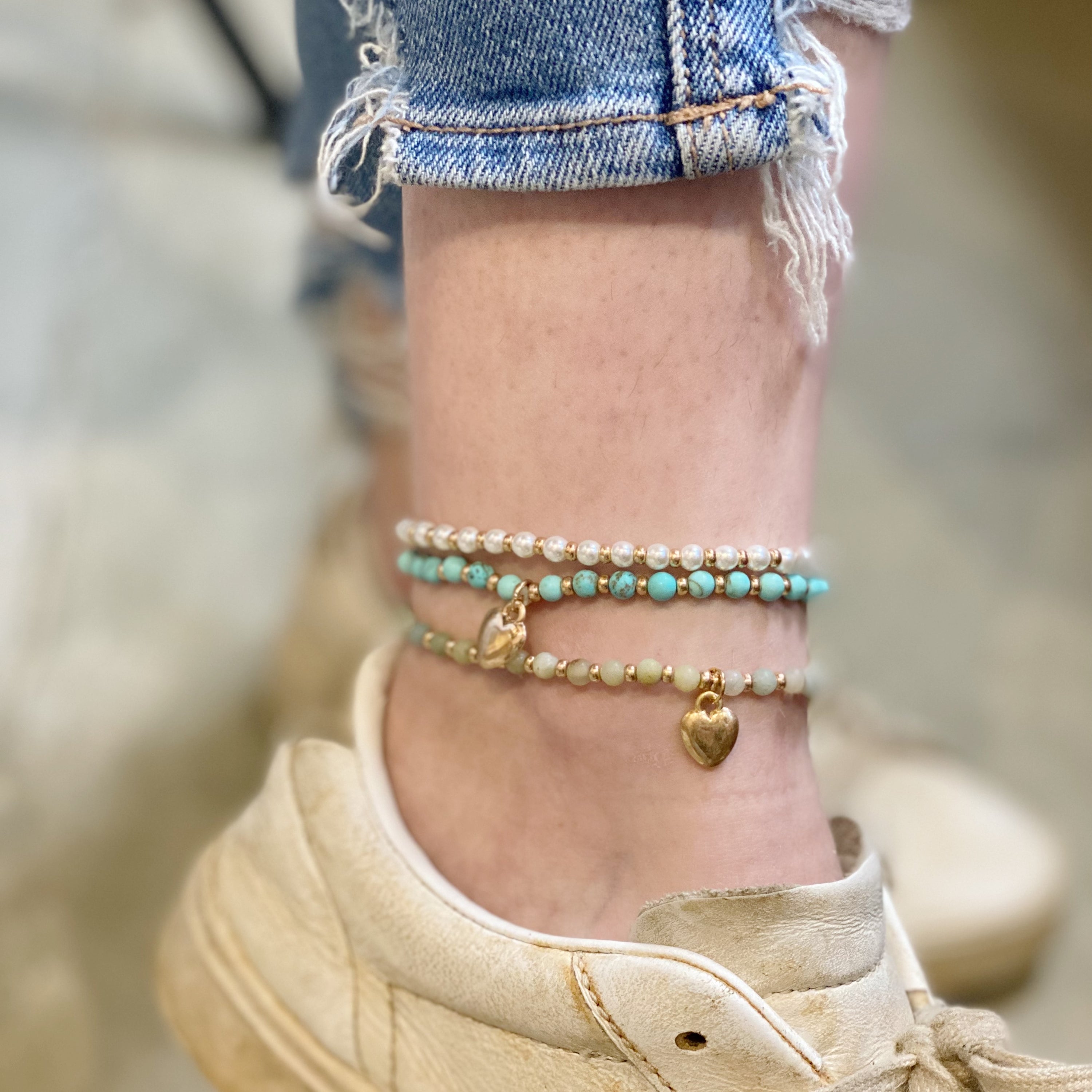 A beautiful stone bead heart anklet featuring semi-precious beads and a charming heart dangle charm, perfect for stacking.