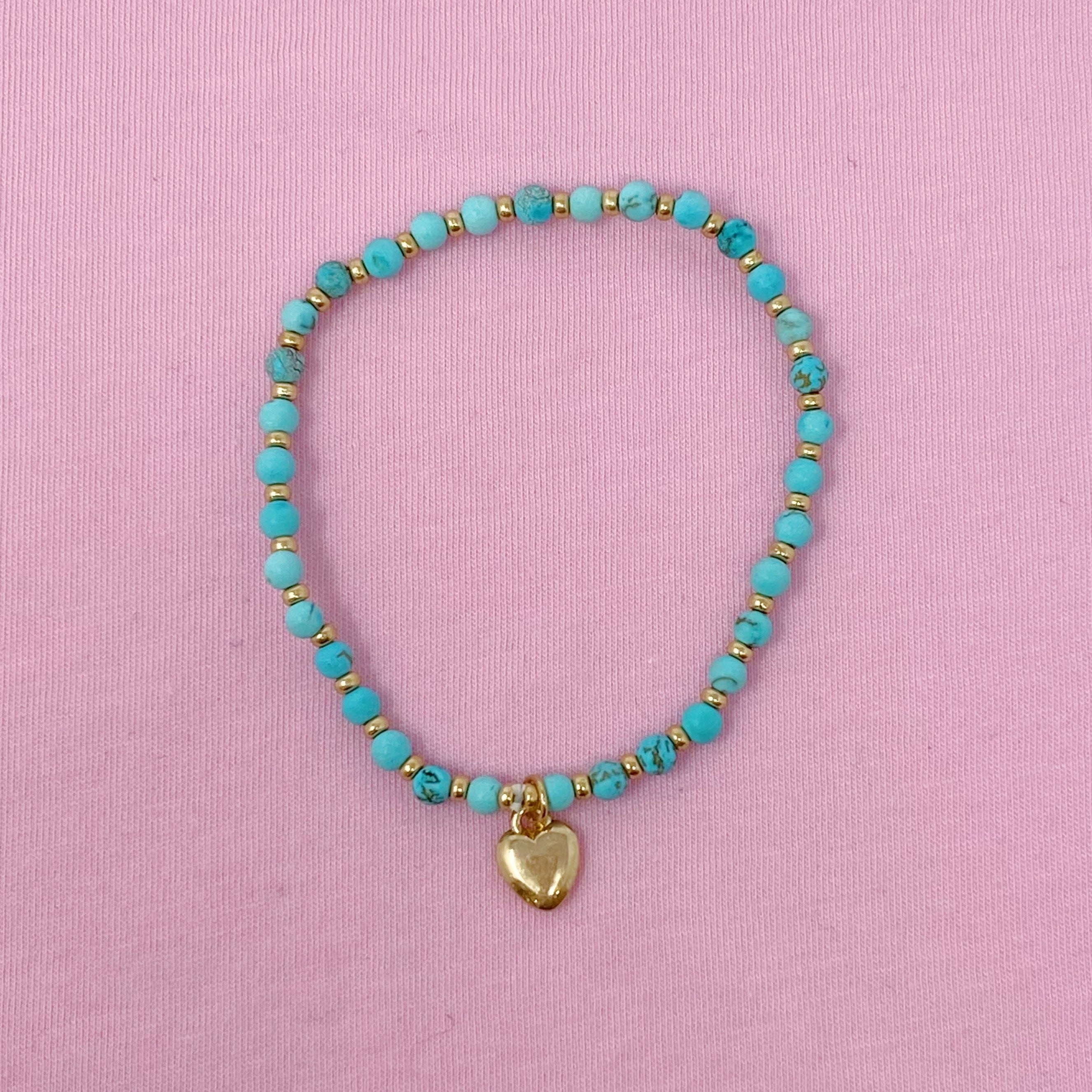 A beautiful stone bead heart anklet featuring semi-precious beads and a charming heart dangle charm, perfect for stacking.