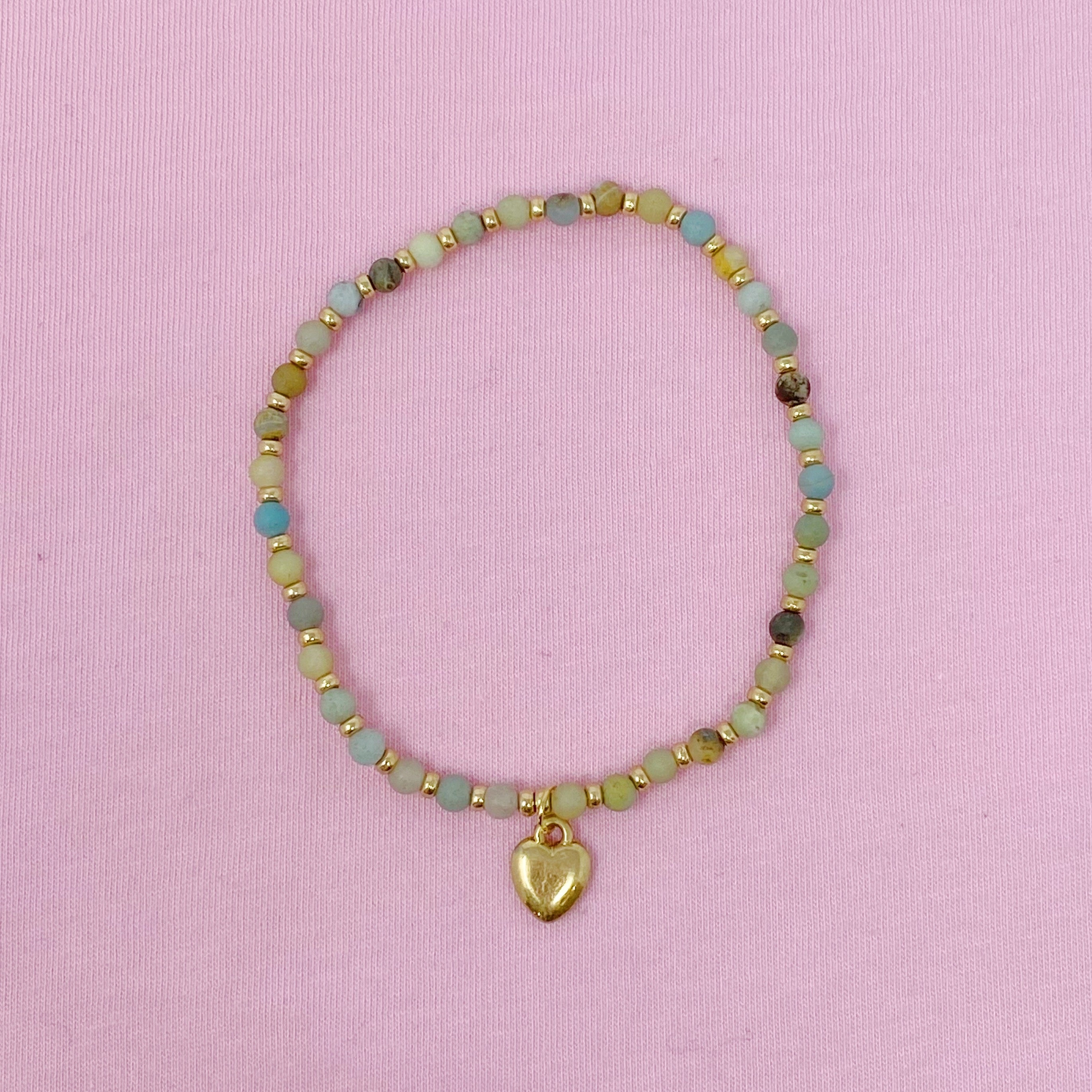 A beautiful stone bead heart anklet featuring semi-precious beads and a charming heart dangle charm, perfect for stacking.