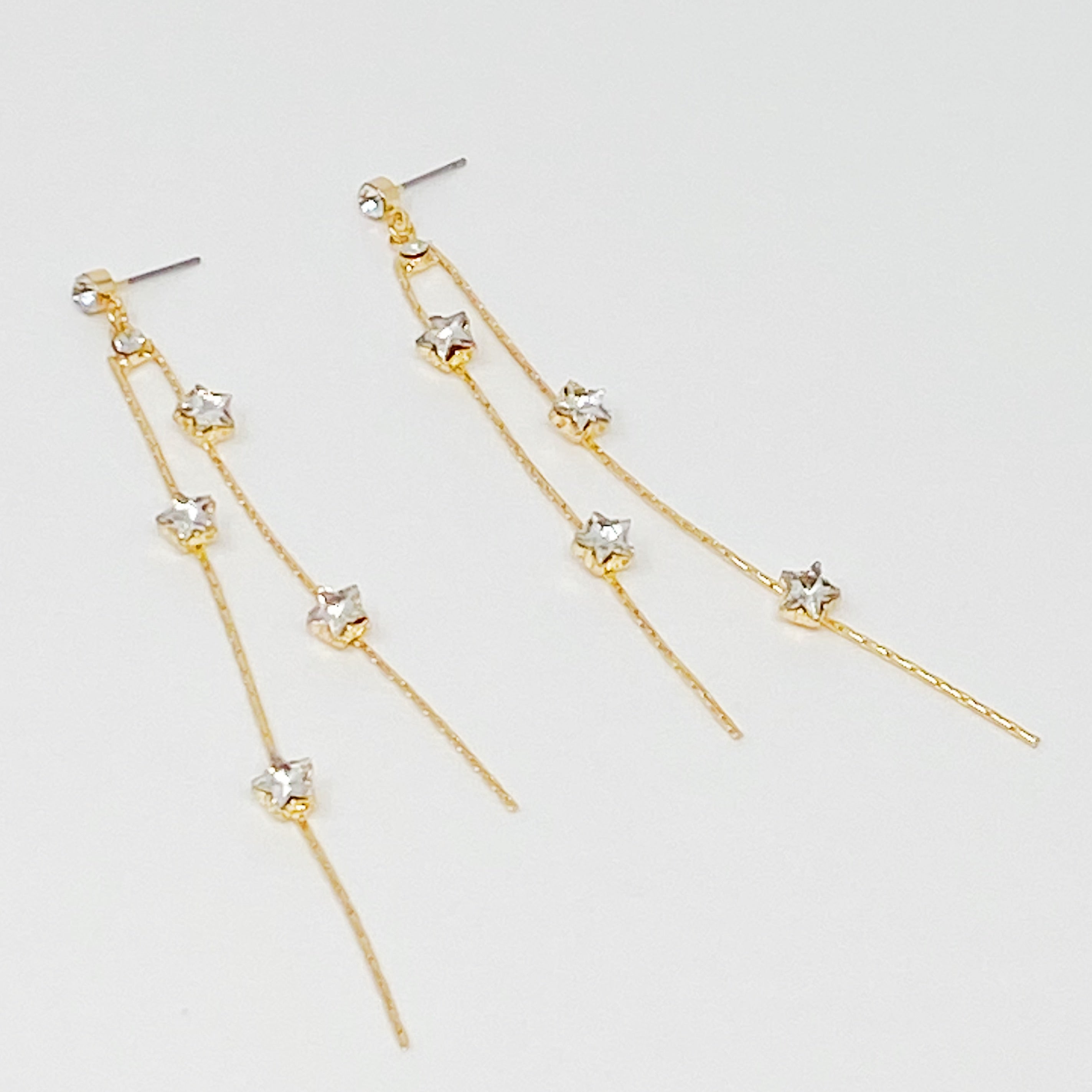 Elegant gold plated Strands of Stars Earrings with delicate design, perfect for festive occasions.