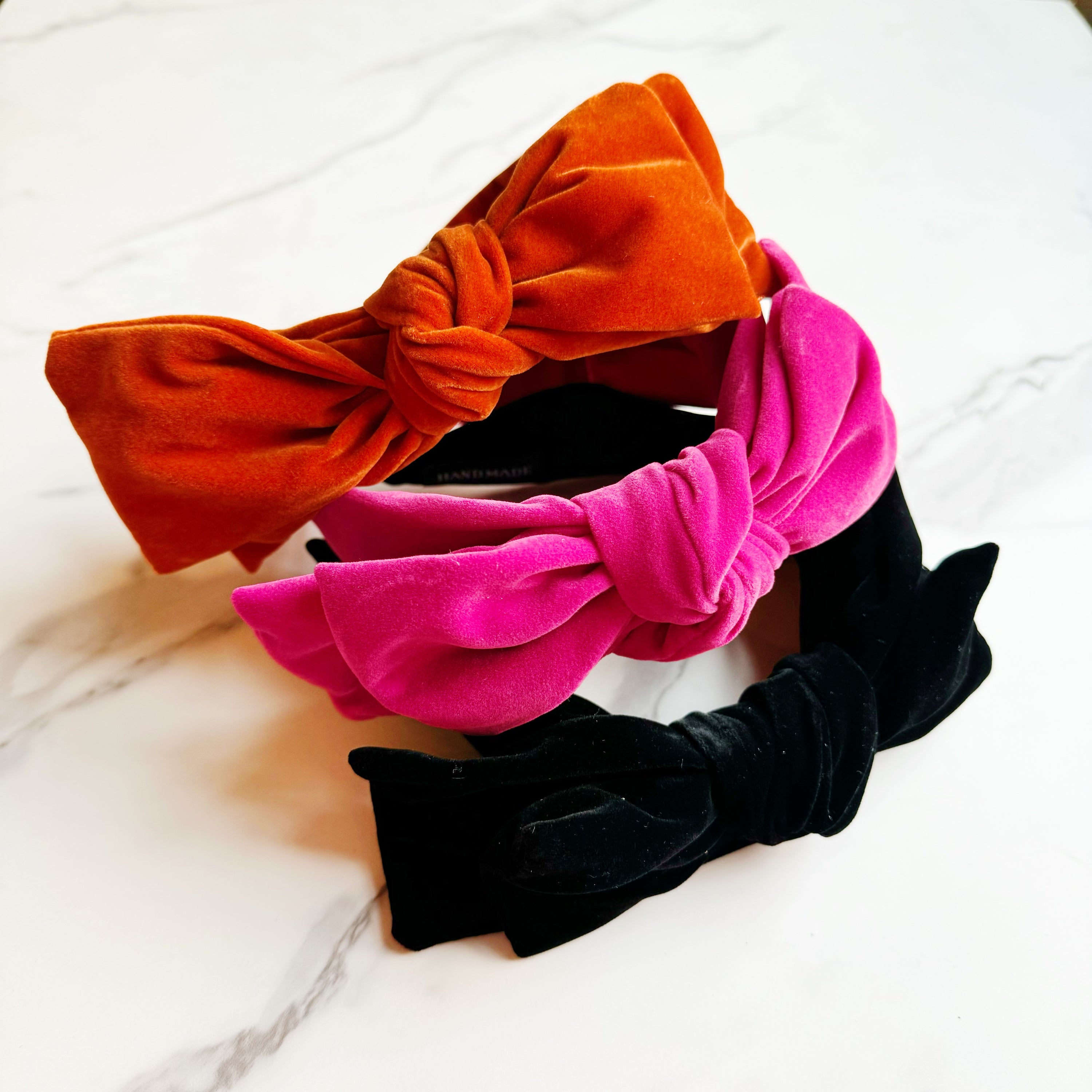 Structured Velvet Bow Headband featuring a sophisticated bow design in rich velvet material, perfect for elevating any outfit.