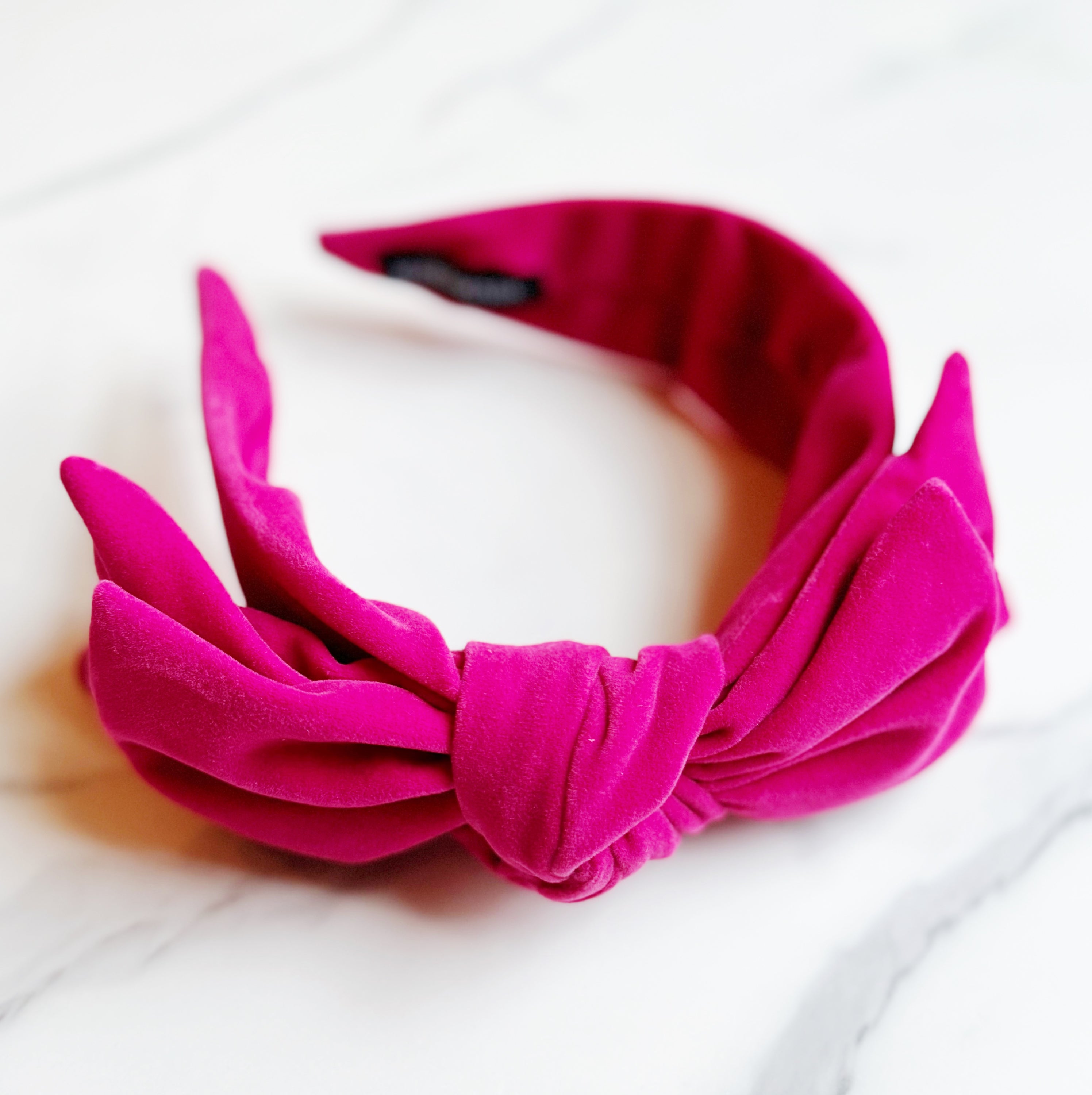 Structured Velvet Bow Headband featuring a sophisticated bow design in rich velvet material, perfect for elevating any outfit.