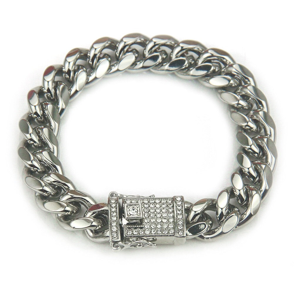 A stylish studded curb chain bracelet made of durable alloy, featuring a bold design perfect for everyday wear.