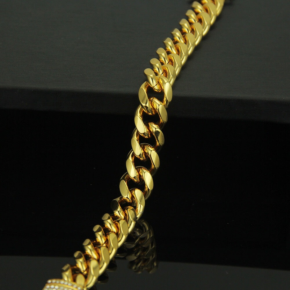 A stylish studded curb chain bracelet made of durable alloy, featuring a bold design perfect for everyday wear.