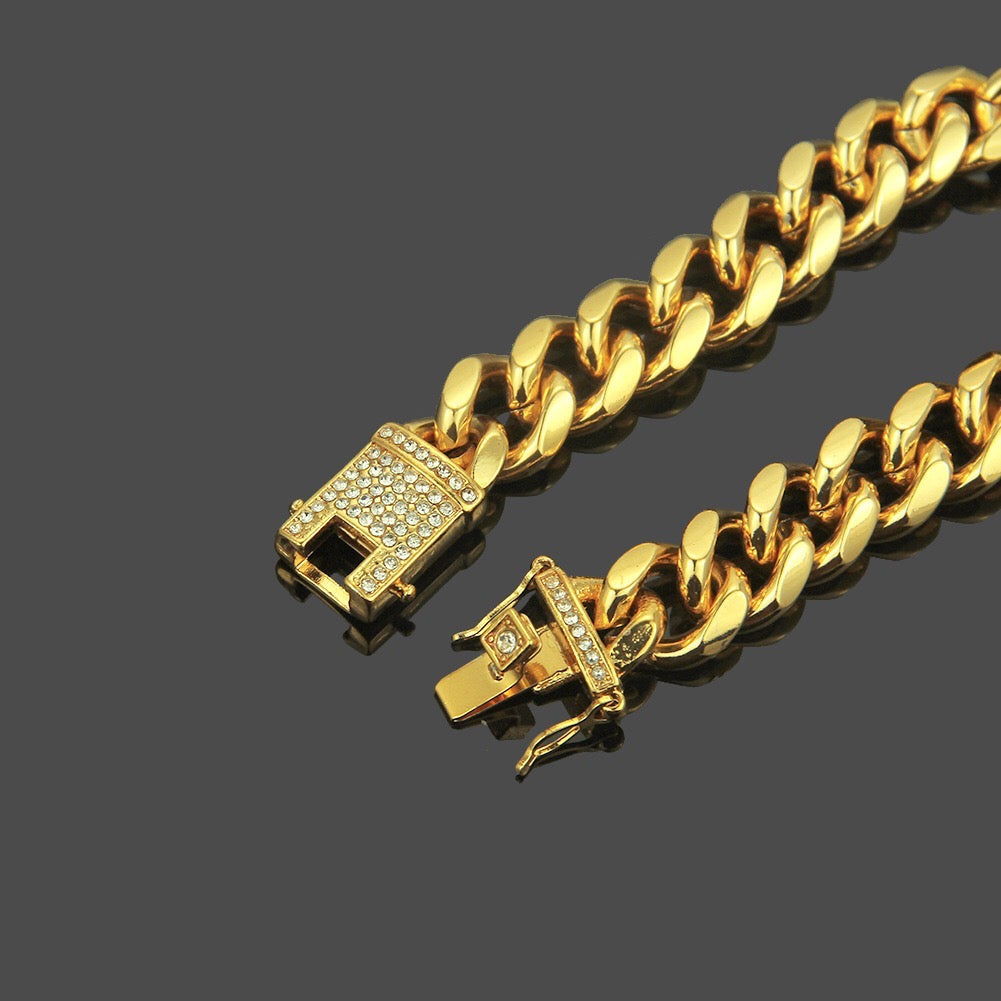 A stylish studded curb chain bracelet made of durable alloy, featuring a bold design perfect for everyday wear.