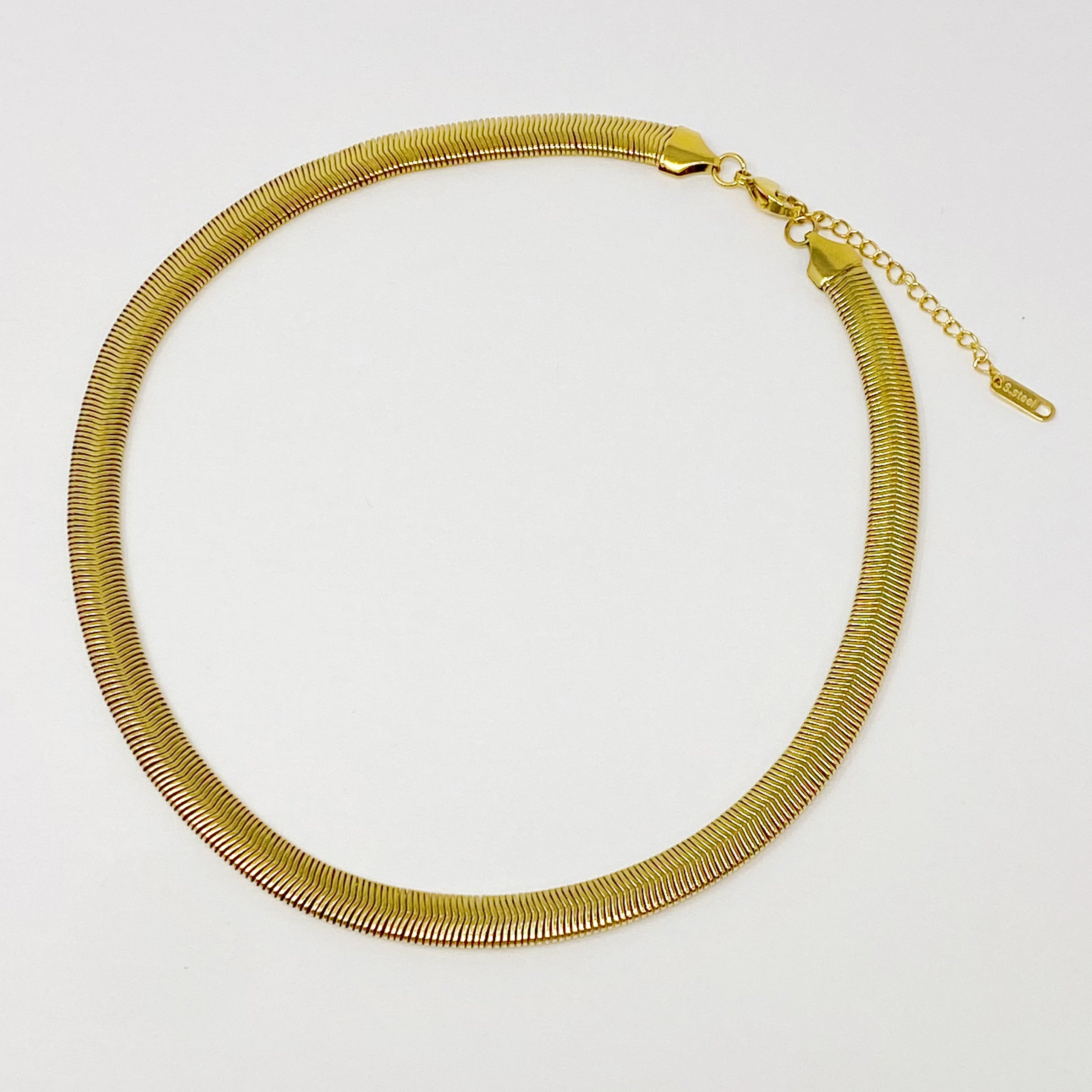 A stylish gold plated herringbone chain necklace with a 16-inch length and 2-inch extender, showcasing its elegant design.