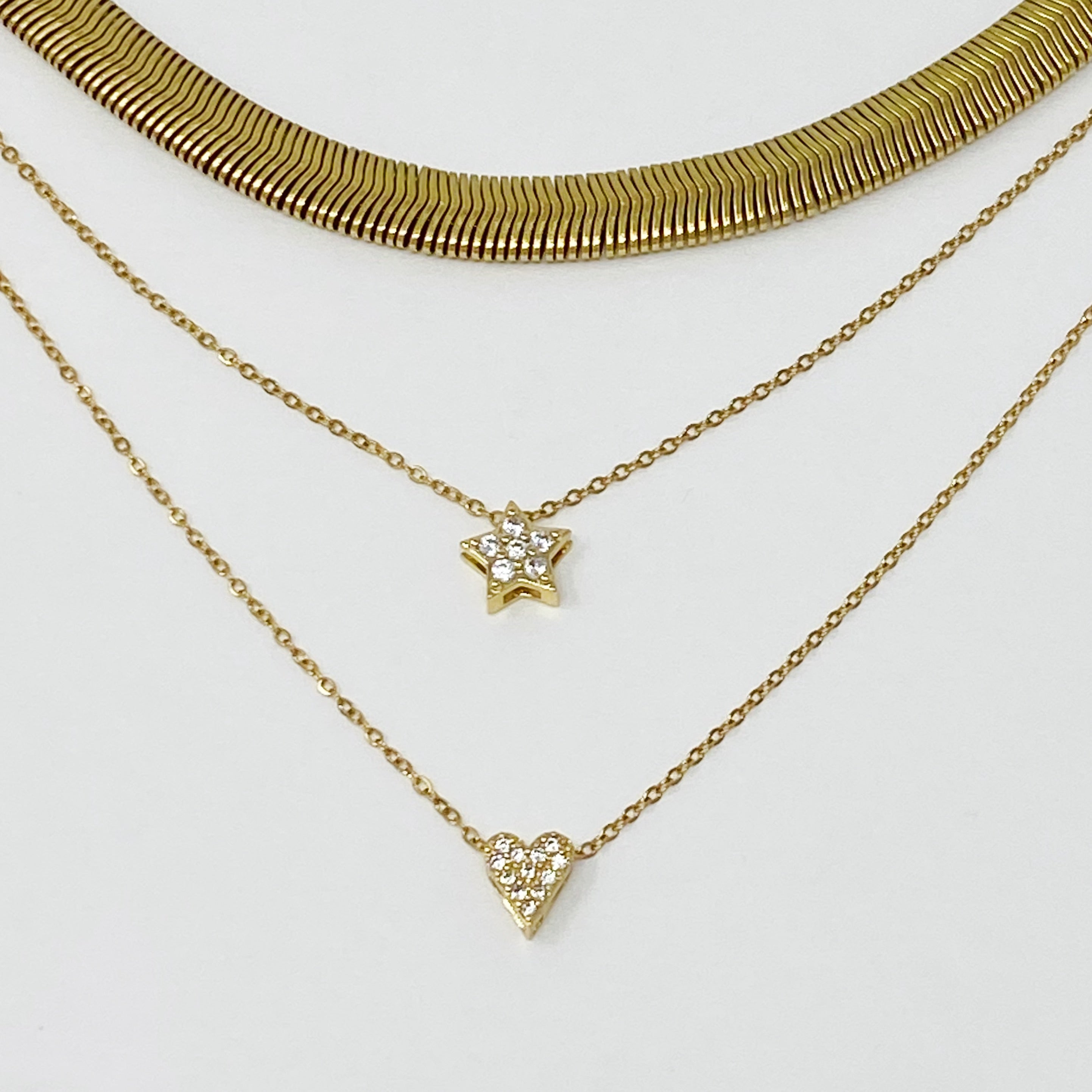 A stylish gold plated herringbone chain necklace with a 16-inch length and 2-inch extender, showcasing its elegant design.