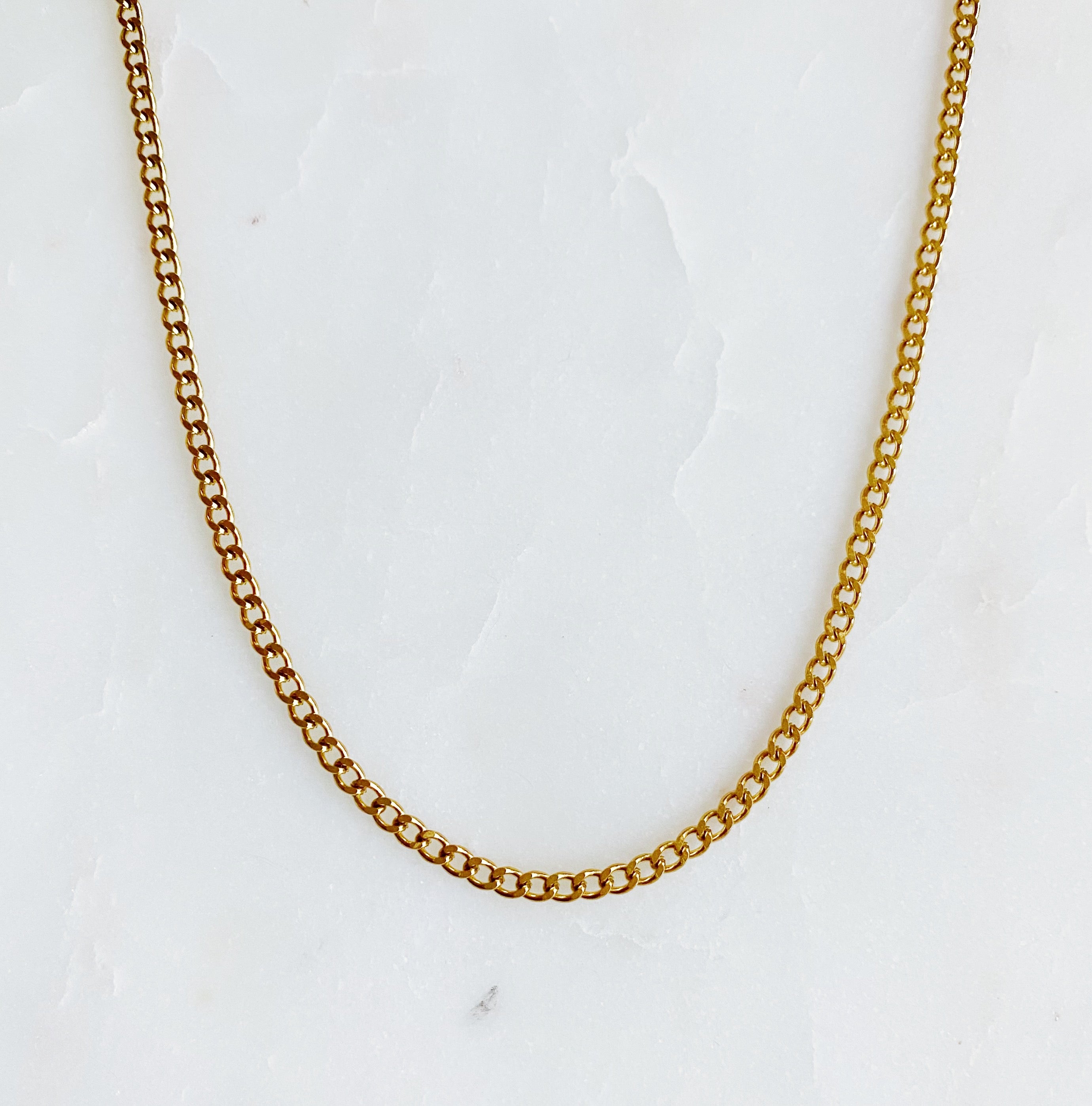 Stylish Cuban Chain Necklace in gold with varying widths, showcasing its elegant design and quality craftsmanship.