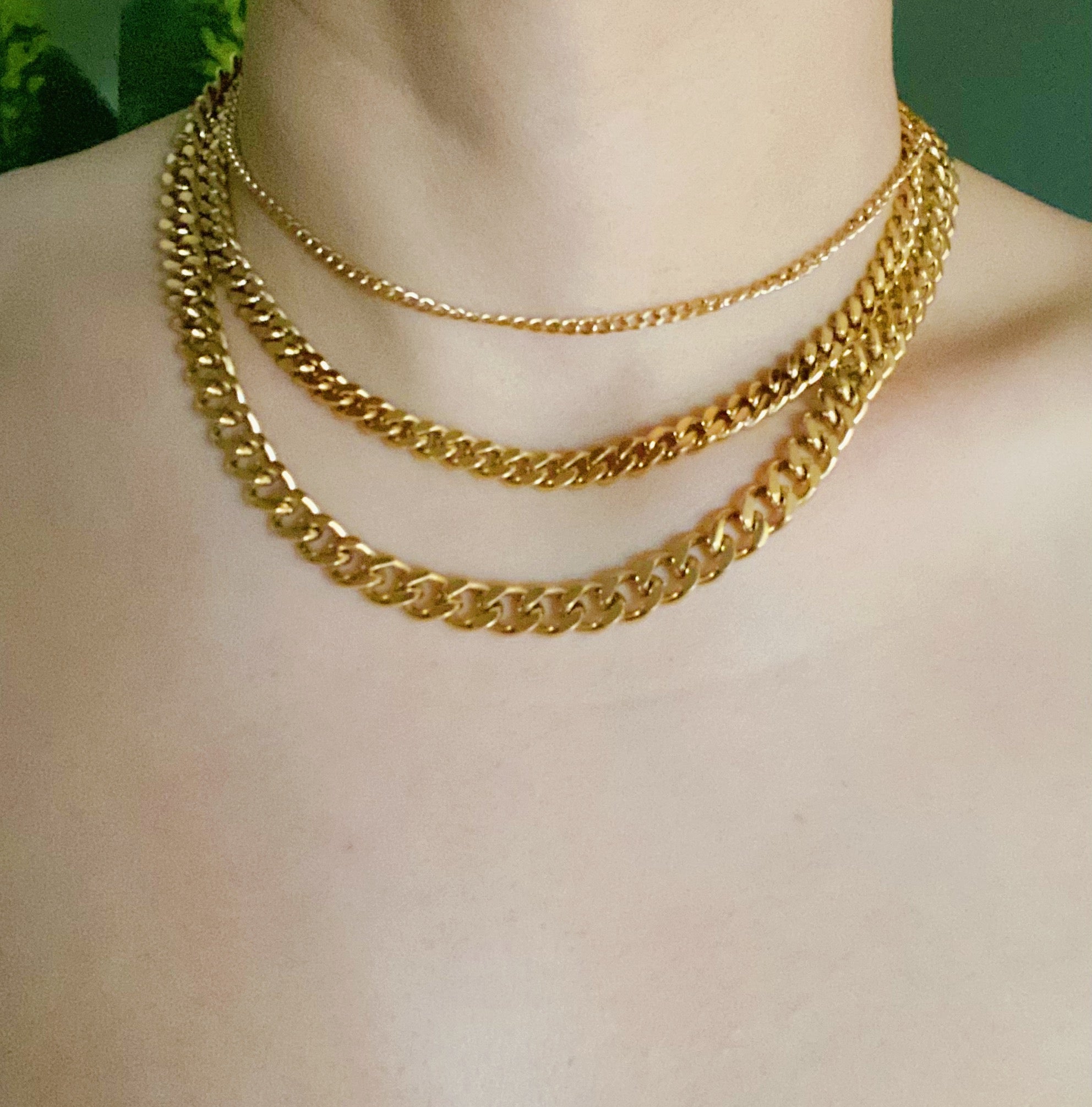 Stylish Cuban Chain Necklace in gold with varying widths, showcasing its elegant design and quality craftsmanship.